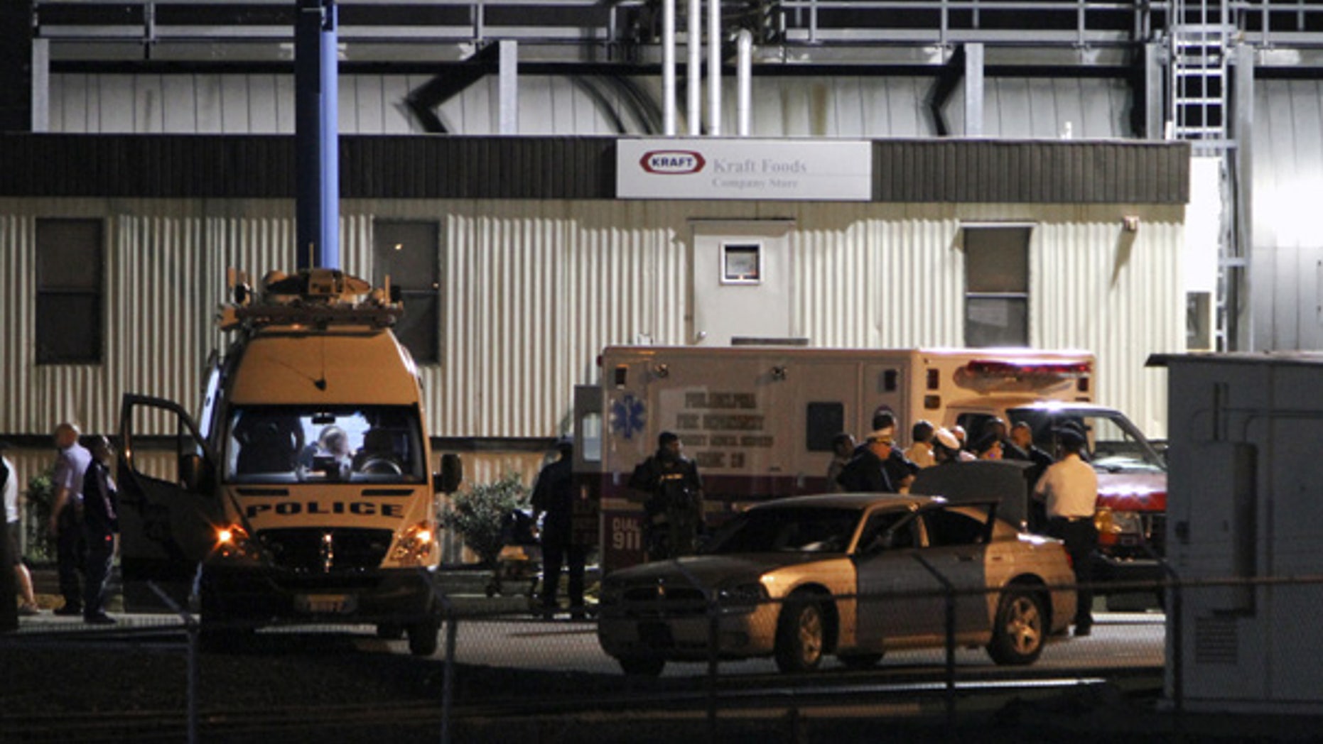 Sept. 9: Police gather at the scene of the shooting at Kraft Foods in Northeast Philadelphia.