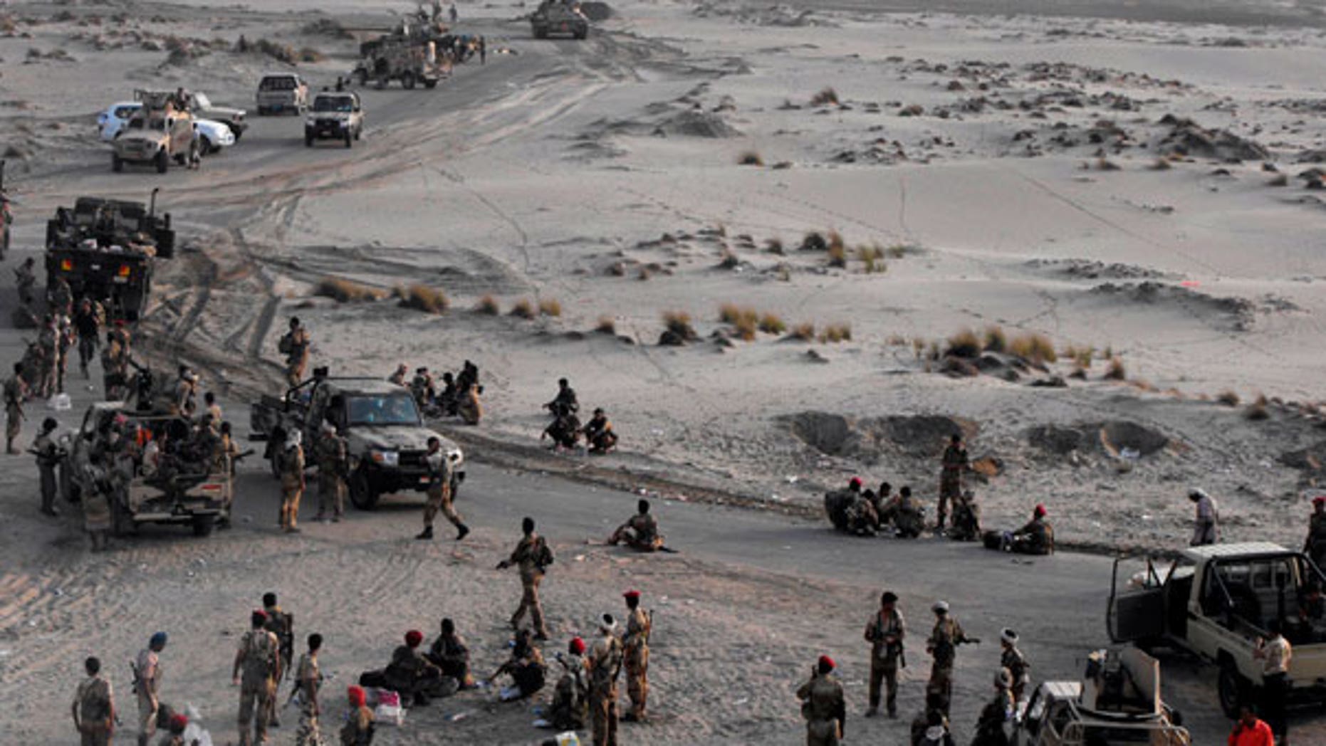 Sept. 10: Yemeni Army forces rest at the southern city of Zinjibar, Yemen, after freeing it from the hands of al-Qaida-linked militants.