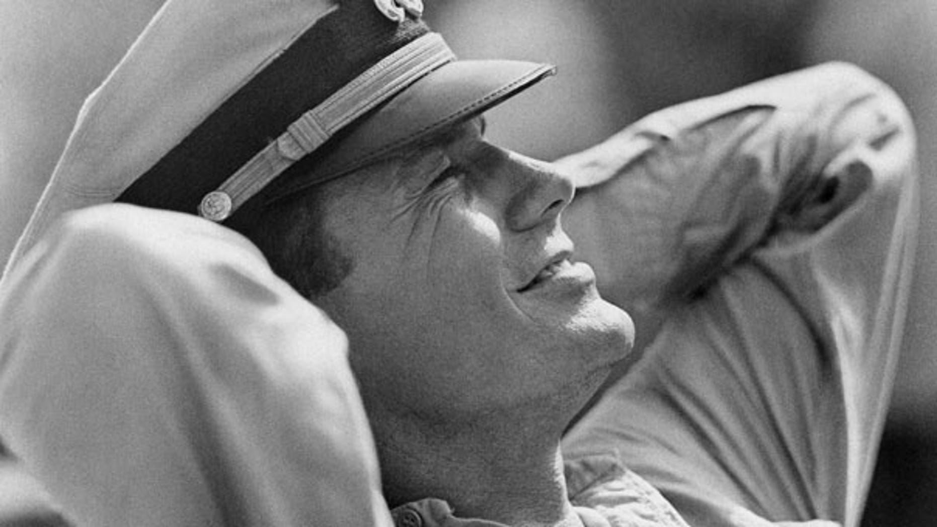 In this Feb. 25, 1963 file photo, actor Cliff Robertson takes a break as the skipper of the PT 109, Lt. John F. Kennedy in the movie "PT 109."