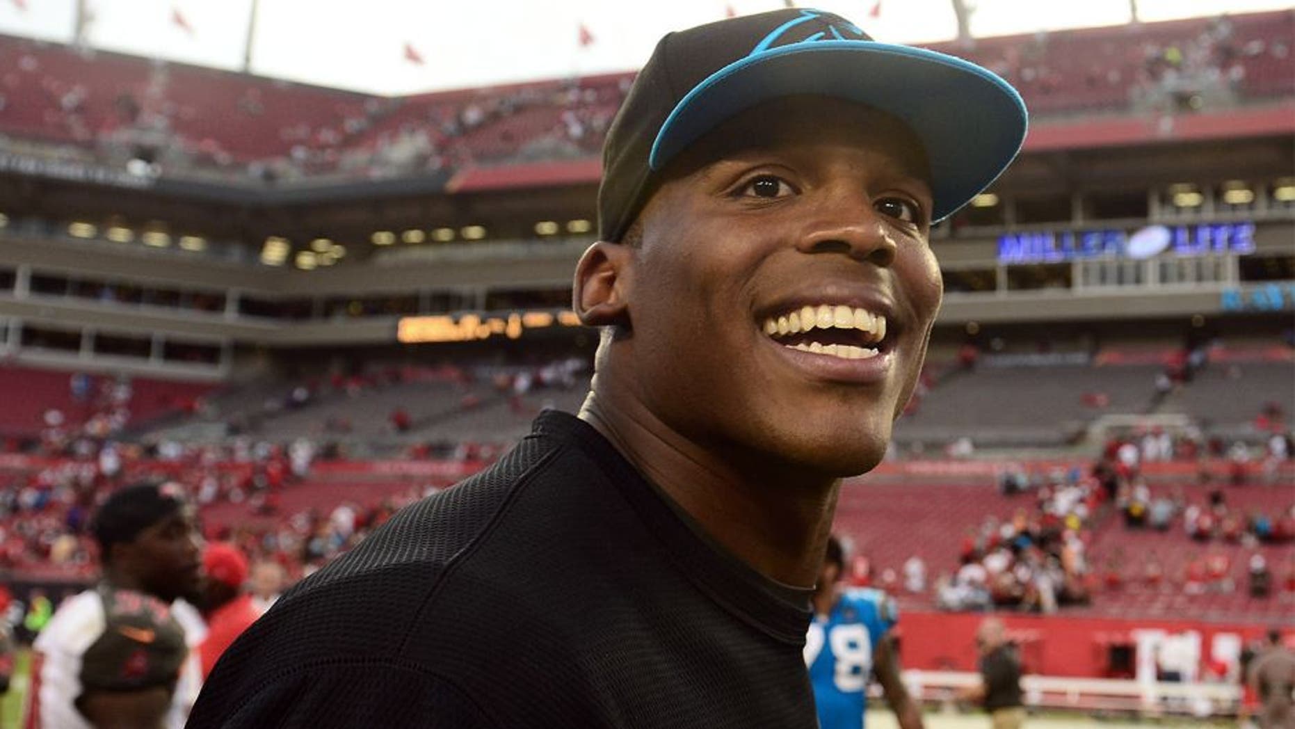 Sep 7, 2014; Tampa, FL, USA; Carolina Panthers quarterback Cam Newton (1) walks off the field after defeating Tampa Bay Buccaneers 20-14 at Raymond James Stadium. Mandatory Credit: Andrew Weber-USA TODAY Sports