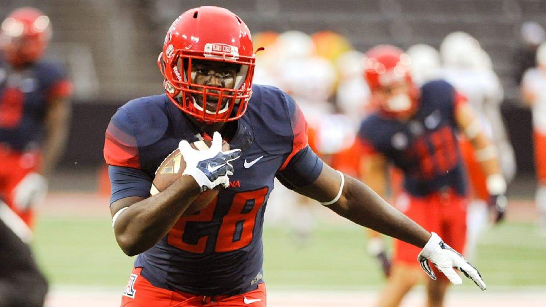 Sep 3, 2015; Tucson, AZ, USA; Arizona Wildcats running back Nick Wilson (28) warms up before playing the Texas-San Antonio Roadrunners at Arizona Stadium. Mandatory Credit: Casey Sapio-USA TODAY Sports