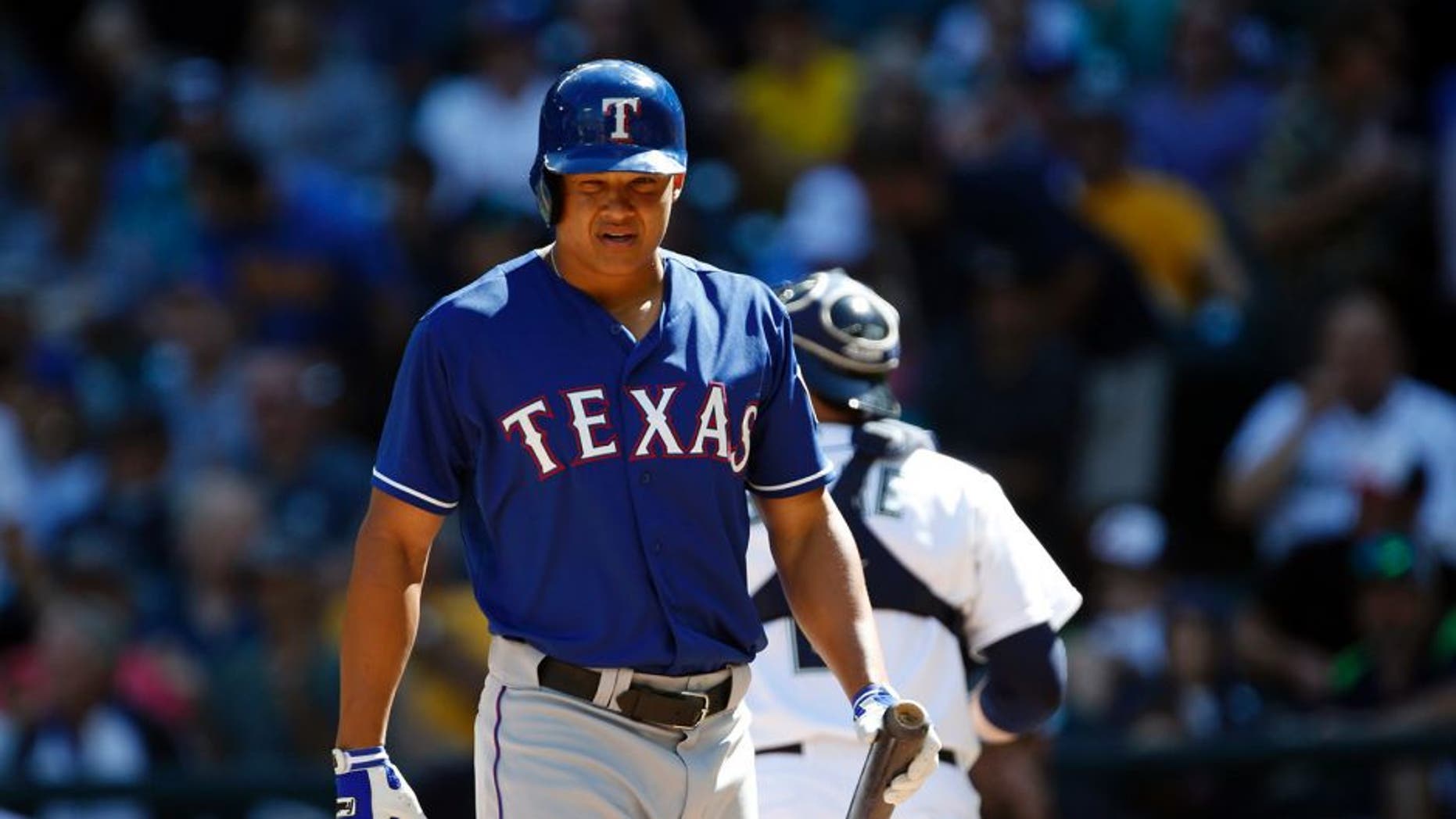Sep 10, 2015; Seattle, WA, USA; Texas Rangers center fielder Will Venable (30) walks back to the bench after sticking out to end the fifth inning against the Seattle Mariners at Safeco Field. Mandatory Credit: Joe Nicholson-USA TODAY Sports