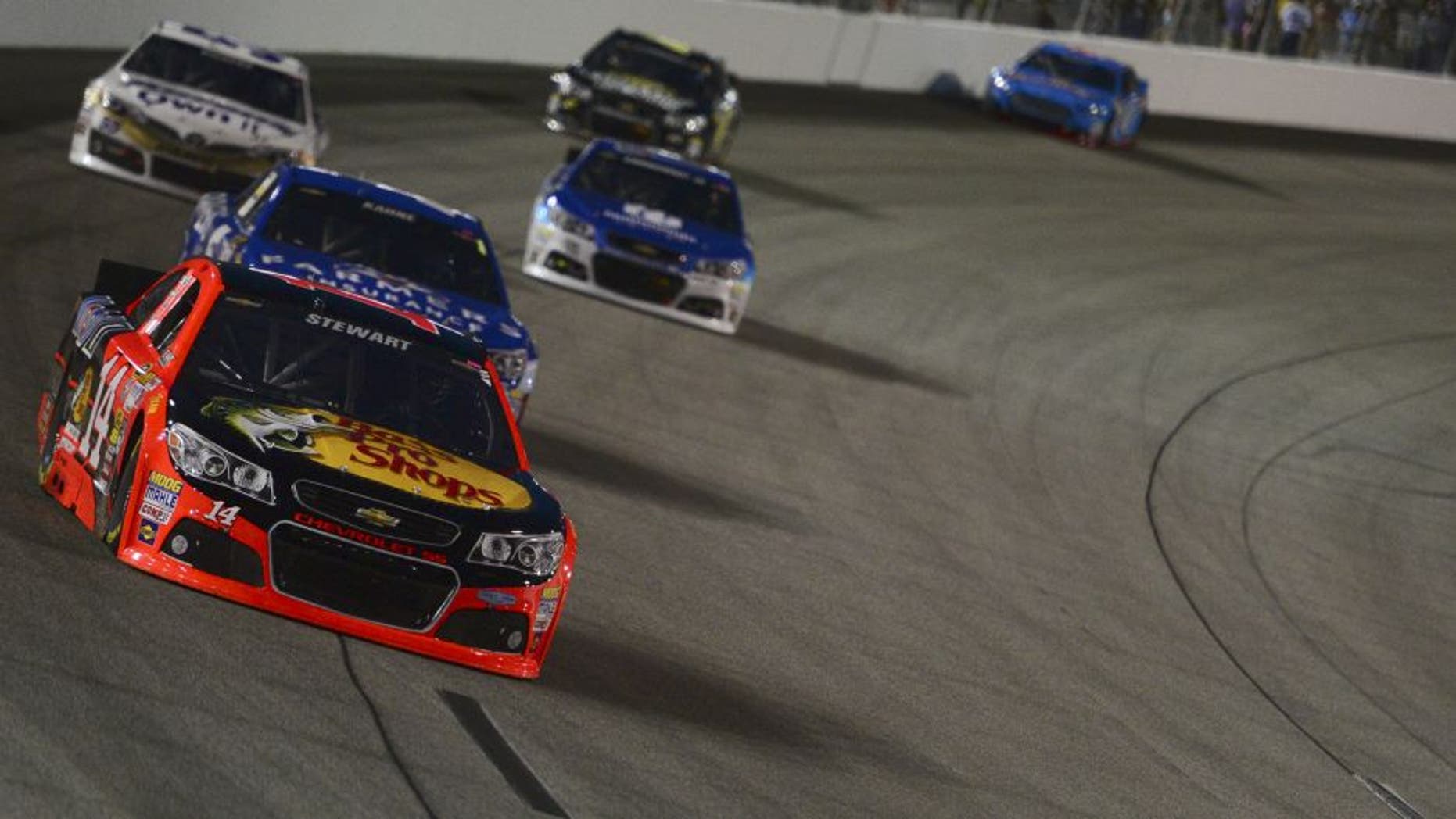 Greg Biffle, driver of the #16 3M Call Before You Dig Ford, leads Ryan Newman, driver of the #31 Caterpillar/ Chevrolet, during the NASCAR Sprint Cup Series Federated Auto Parts 400 at Richmond International Raceway on September 6, 2014 in Richmond, Virginia.