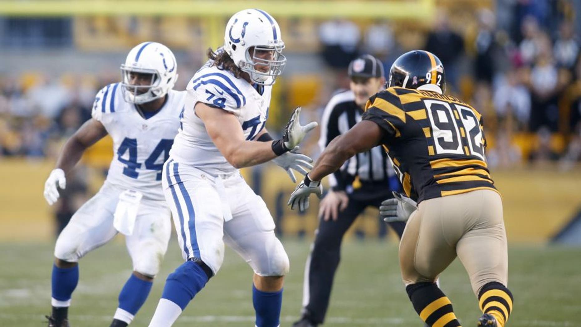 Oct 26, 2014; Pittsburgh, PA, USA; Indianapolis Colts tackle Anthony Castonzo (74) blocks at the line of scrimmage against Pittsburgh Steelers linebacker James Harrison (92) during the second quarter at Heinz Field. The Steelers won 51-34. Mandatory Credit: Charles LeClaire-USA TODAY Sports
