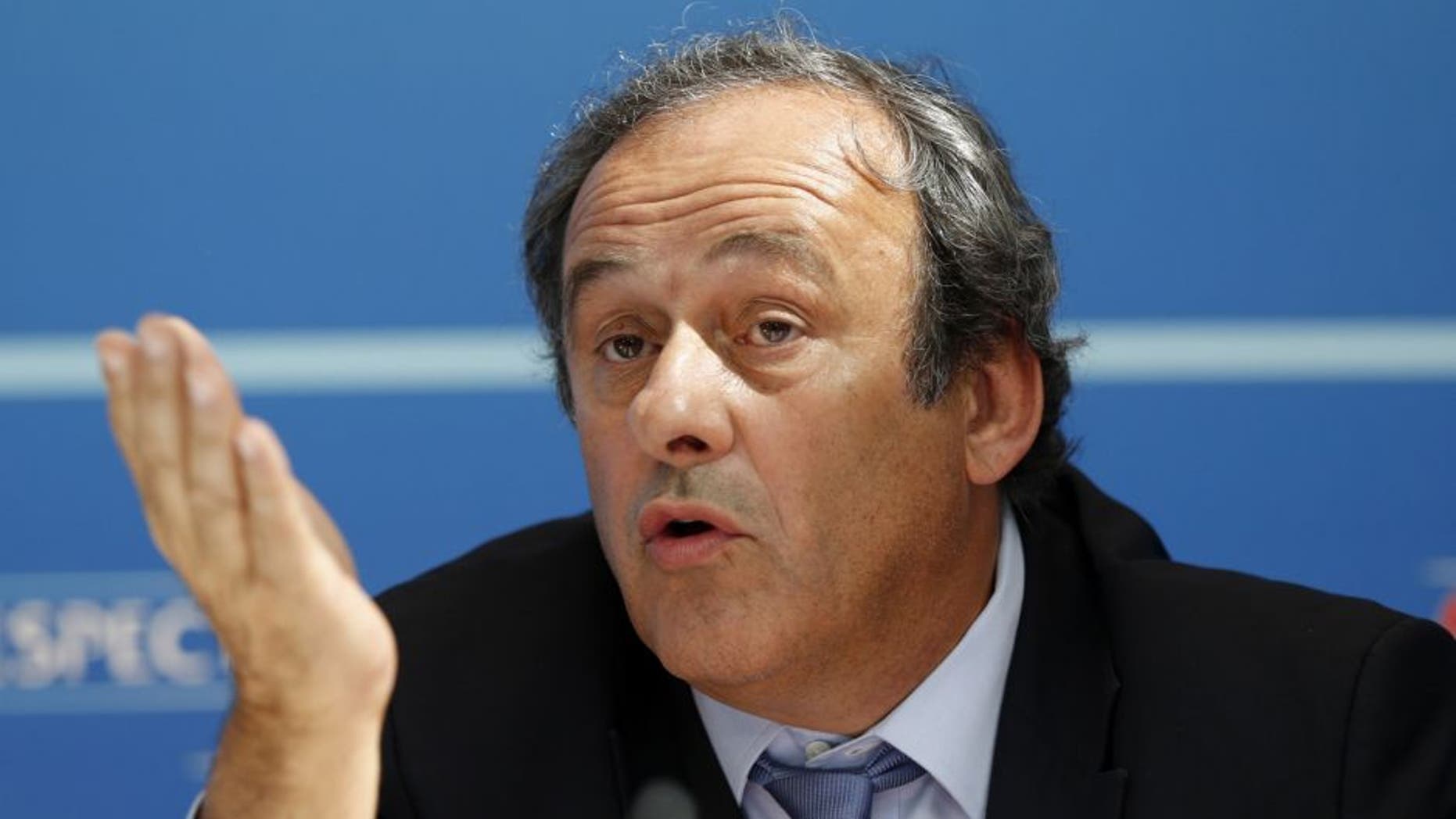 UEFA chief Michel Platini gestures as he speaks during a UEFA press conference after the draw for the UEFA Europa League football group stage 2015/16 on August 28, 2015 in Monaco. AFP PHOTO / VALERY HACHE (Photo credit should read VALERY HACHE/AFP/Getty Images)