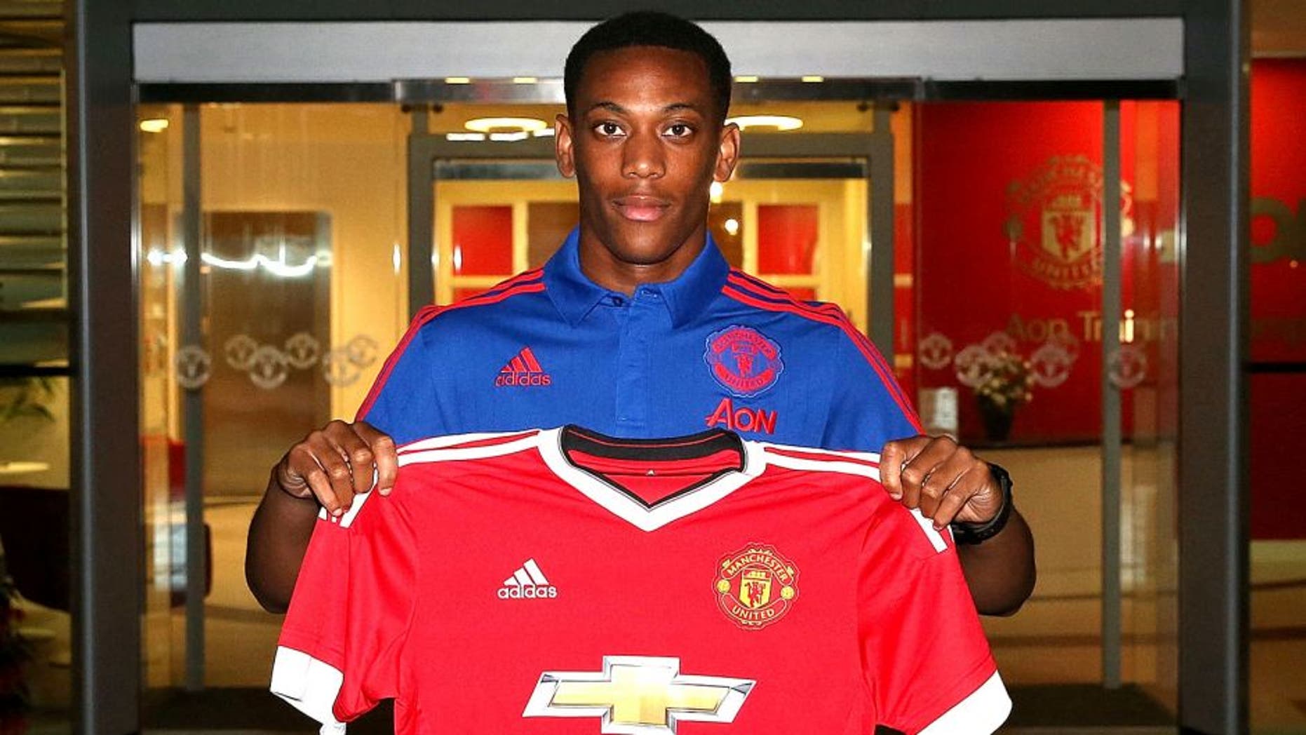 MANCHESTER, ENGLAND - SEPTEMBER 01: (EXCLUSIVE COVERAGE) (MINIMUM FEES APPLY - 150 GBP PRINT AND ON AIR & 75 GBP ONLINE OR LOCAL EQUIVALENT, PER IMAGE) Manchester United unveil new signing Anthony Martial at Aon Training Complex on September 1, 2015 in Manchester, England. (Photo by John Peters/Man Utd via Getty Images)