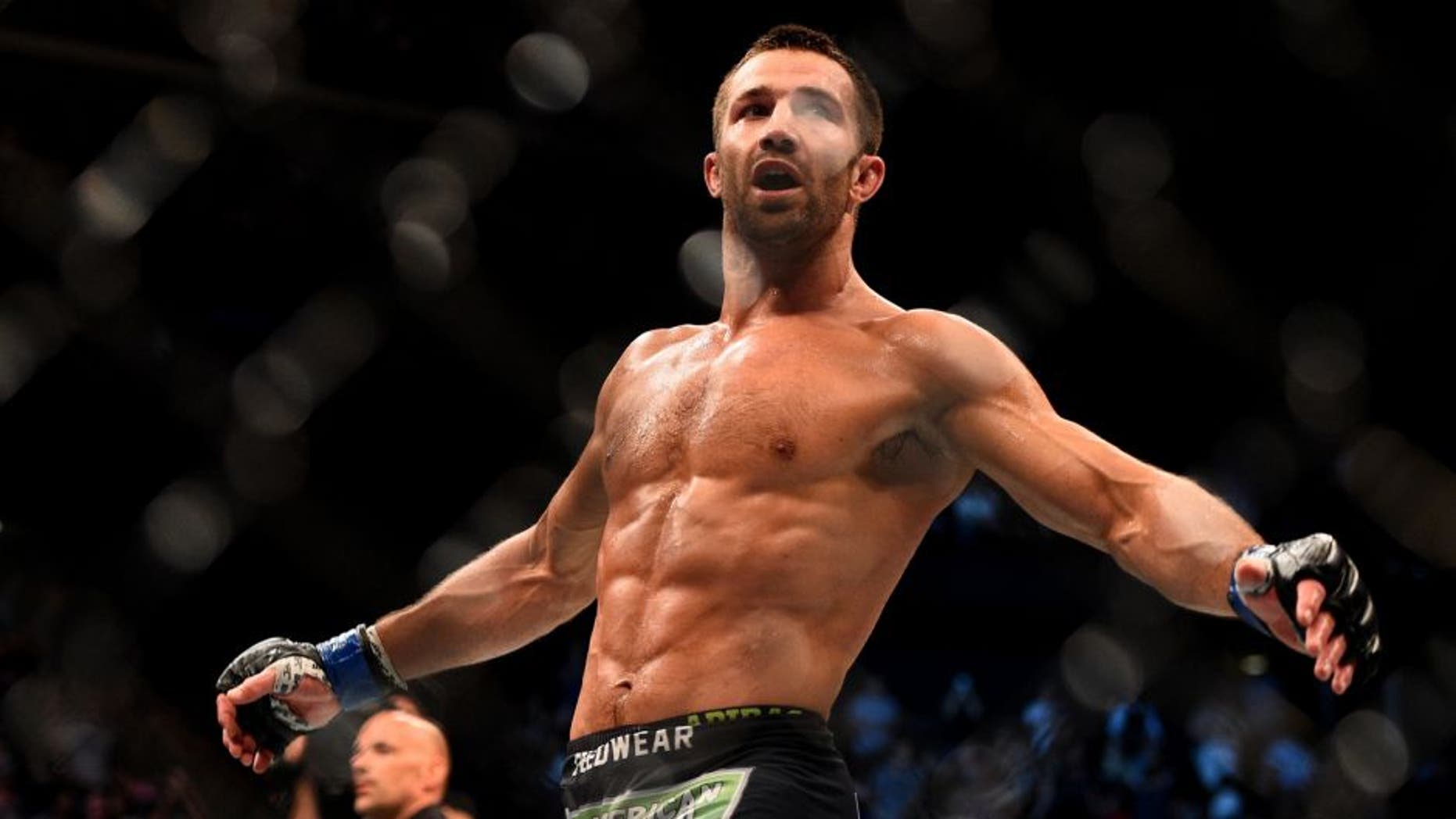 NEWARK, NJ - APRIL 18: Luke Rockhold celebrates defeating Lyoto Machida of Brazil by tap out in their middleweight bout during the UFC Fight Night event at Prudential Center on April 18, 2015 in Newark, New Jersey. (Photo by Jeff Bottari/Zuffa LLC/Zuffa LLC via Getty Images)