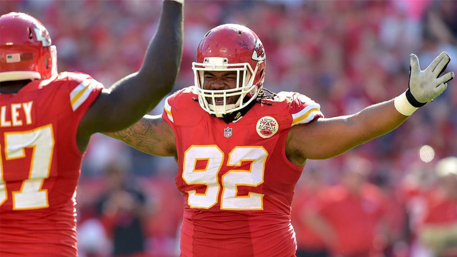 Oct 26, 2014; Kansas City, MO, USA; Kansas City Chiefs nose tackle Dontari Poe (92) congratulates defensive end Allen Bailey (97) after Bailey's sack of St. Louis Rams quarterback Austin Davis (9) (not pictured) during the second half at Arrowhead Stadium. The Chiefs won 34-7. Mandatory Credit: Denny Medley-USA TODAY Sports