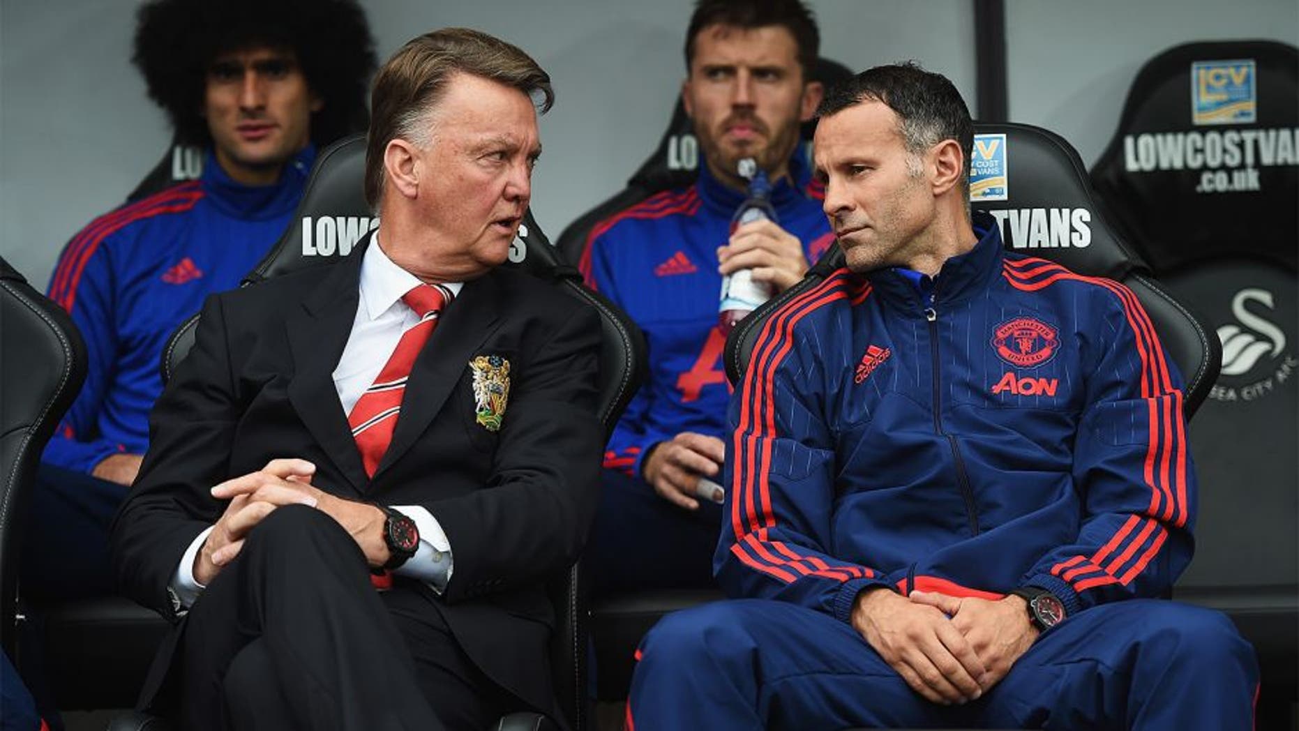 SWANSEA, WALES - AUGUST 30: Louis van Gaal, manager of Manchester United talks to assistant Ryan Giggs during the Barclays Premier League match between Swansea City and Manchester United at Liberty Stadium on August 30, 2015 in Swansea, Wales. (Photo by Michael Regan/Getty Images)