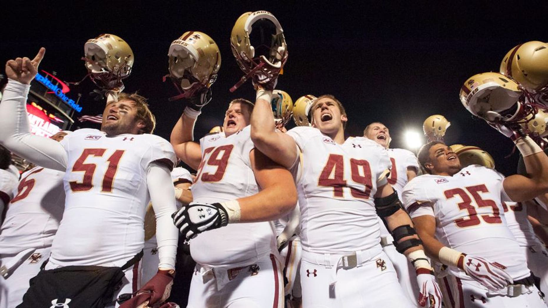 Nov 23, 2013; College Park, MD, USA; Boston College Eagles celebrates with their fans after the game against the Maryland Terrapins at Byrd Stadium. Boston College Eagles defeated Maryland Terrapins 29-26. Mandatory Credit: Tommy Gilligan-USA TODAY Sports