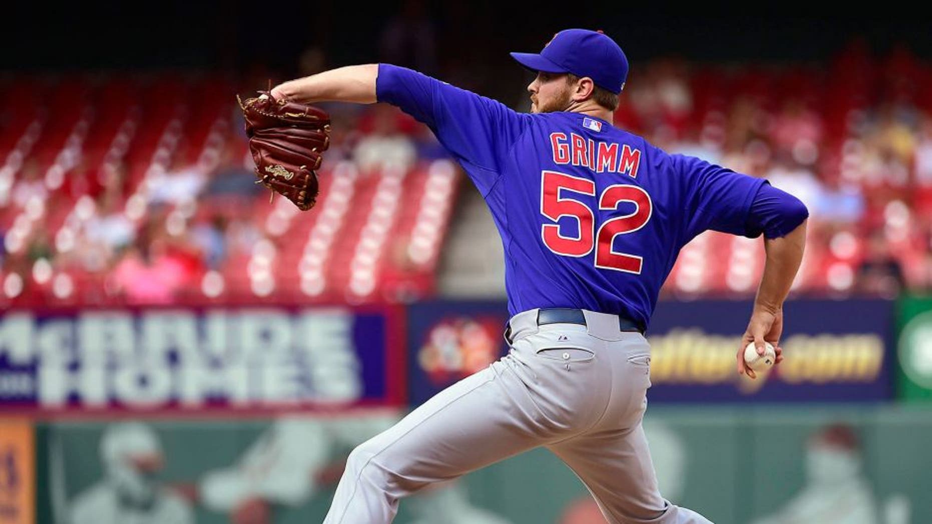 Aug 30, 2014; St. Louis, MO, USA; Chicago Cubs relief pitcher Justin Grimm (52) delivers a pitch against the St. Louis Cardinals during the ninth inning at Busch Stadium. The Cubs defeated the Cardinals 5-1. Mandatory Credit: Scott Rovak-USA TODAY Sports