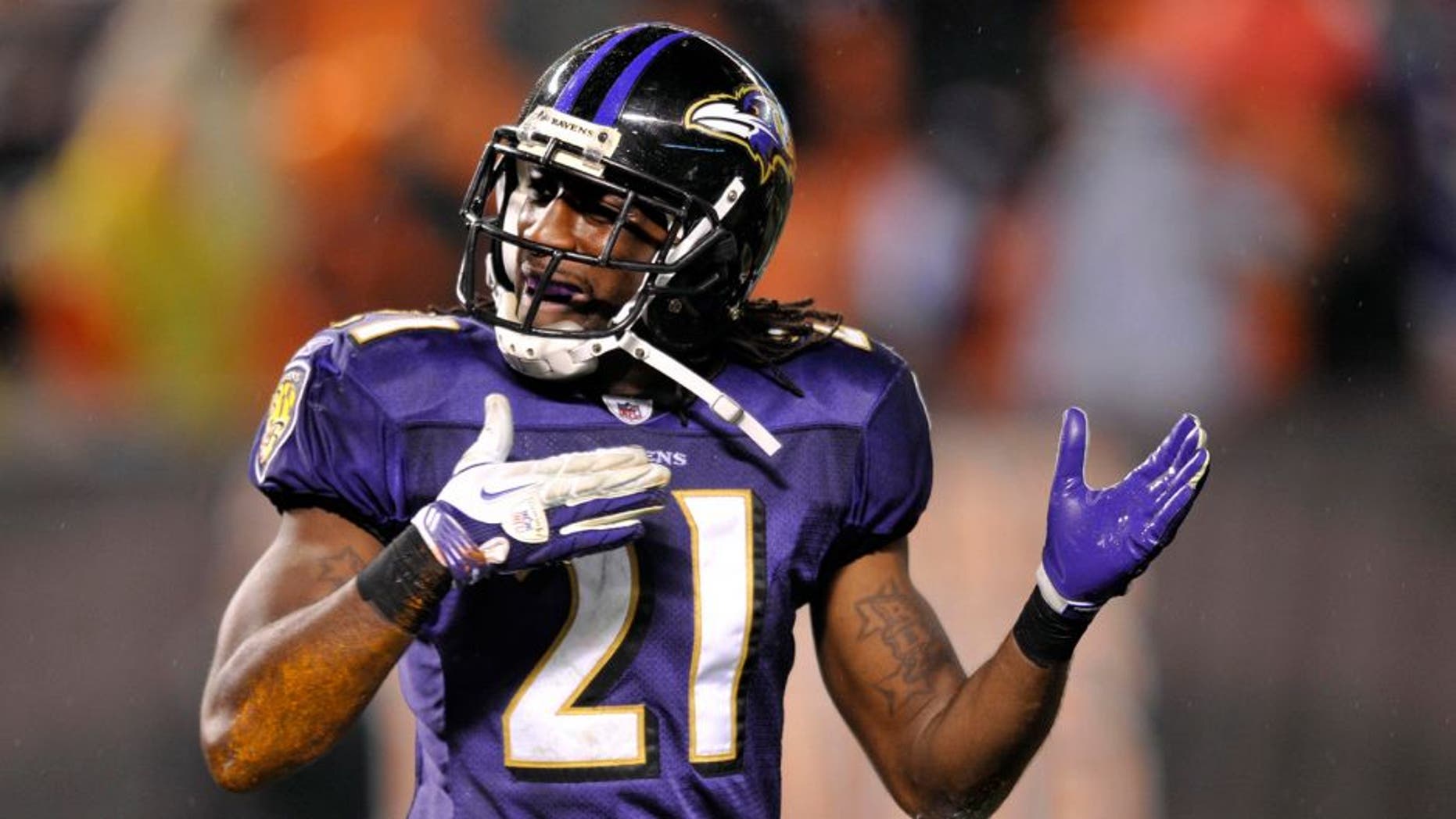 Dec 4, 2011; Cleveland, OH, USA; Baltimore Ravens returner Lardarius Webb (21) celebrates a 68-yard punt return against the Cleveland Browns in the fourth quarter at Cleveland Browns Stadium. Mandatory Credit: David Richard-USA TODAY Sports