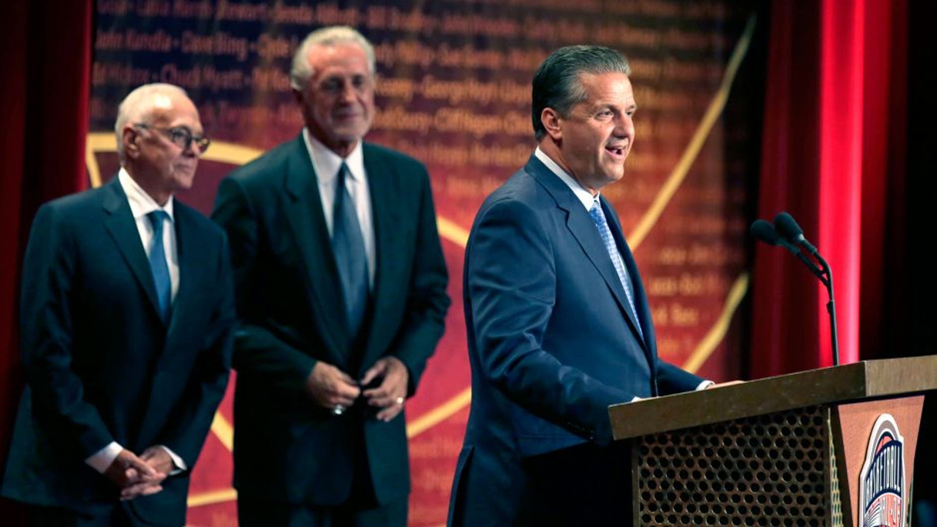 Basketball Hall of Fame inductee coach John Calipari stands with his presenters Larry Brown, left, and Pat Riley during the enshrinement ceremony for the Class of 2015 of the Naismith Memorial Basketball Hall of Fame in Springfield, Mass., Friday, Sept. 11, 2015. (AP Photo/Charles Krupa)