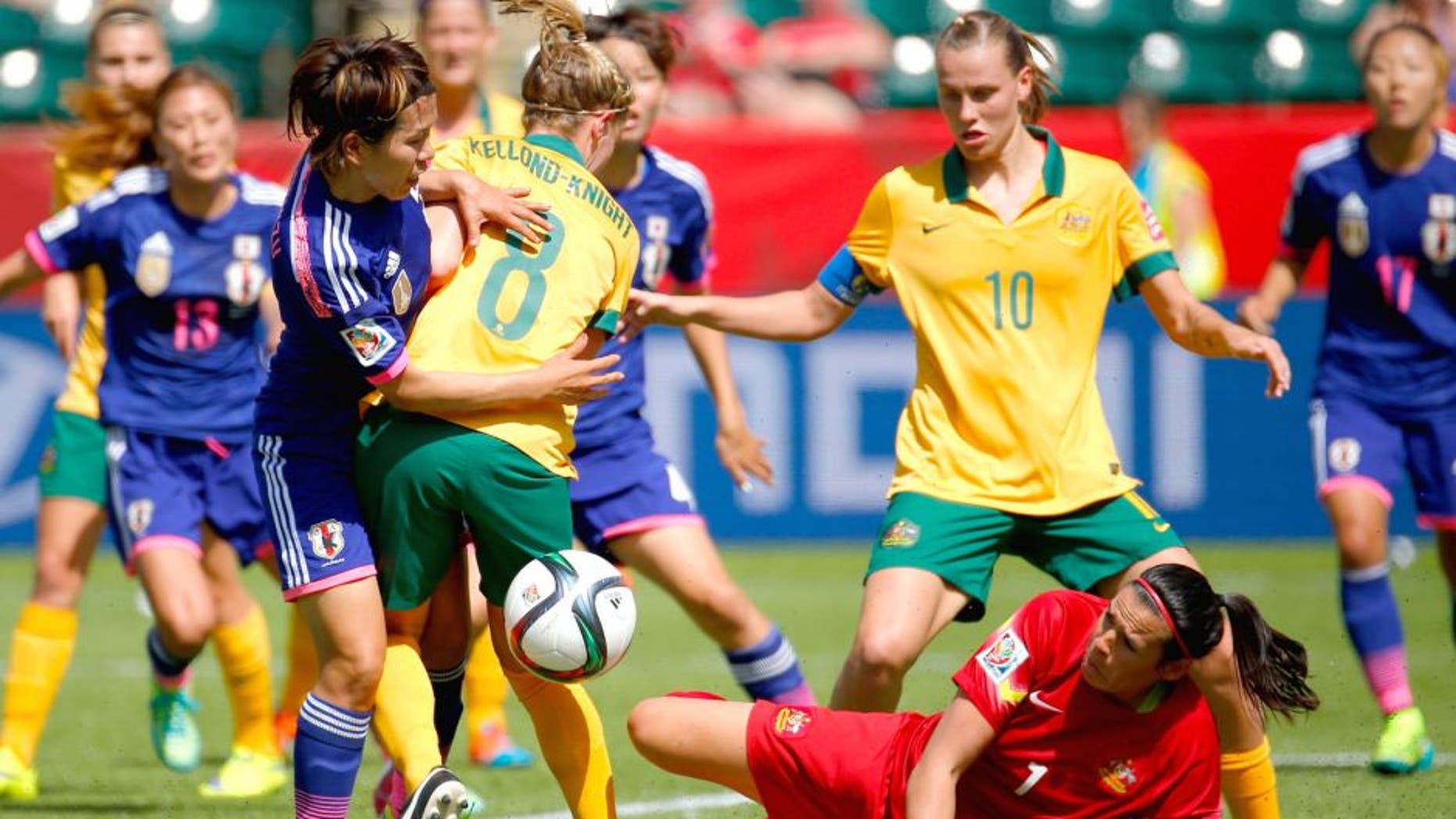 EDMONTON, AB - JUNE 27: Elise Kellond-Knight #8 defends as goalkeeper Lydia Williams #1 of Australia attempts to save the ball against Azusa Iwashimizu #3 of Japan during the FIFA Women's World Cup Canada 2015 Quarter Final match between Australia and Japan at Commonwealth Stadium on June 27, 2015 in Edmonton, Canada. (Photo by Kevin C. Cox/Getty Images)