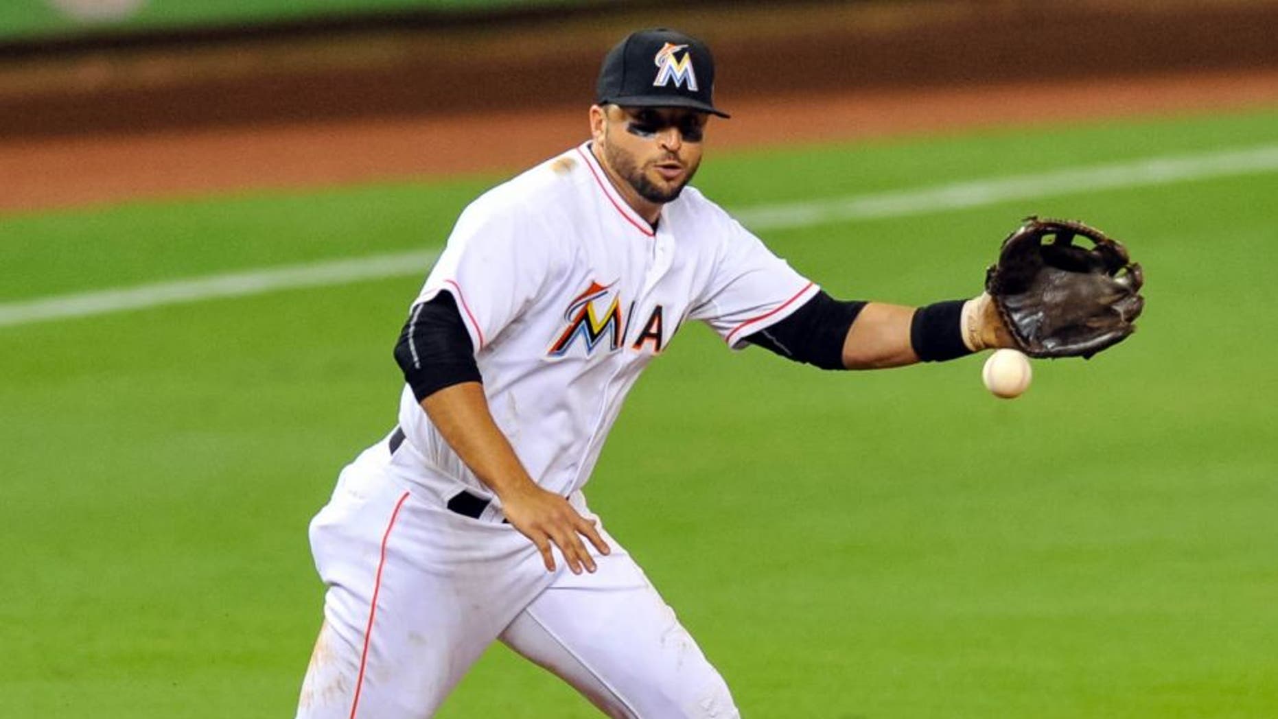 Sep 11, 2015; Miami, FL, USA; Miami Marlins third baseman Martin Prado (14) fields a play during the third inning against the Washington Nationals at Marlins Park. Mandatory Credit: Steve Mitchell-USA TODAY Sports