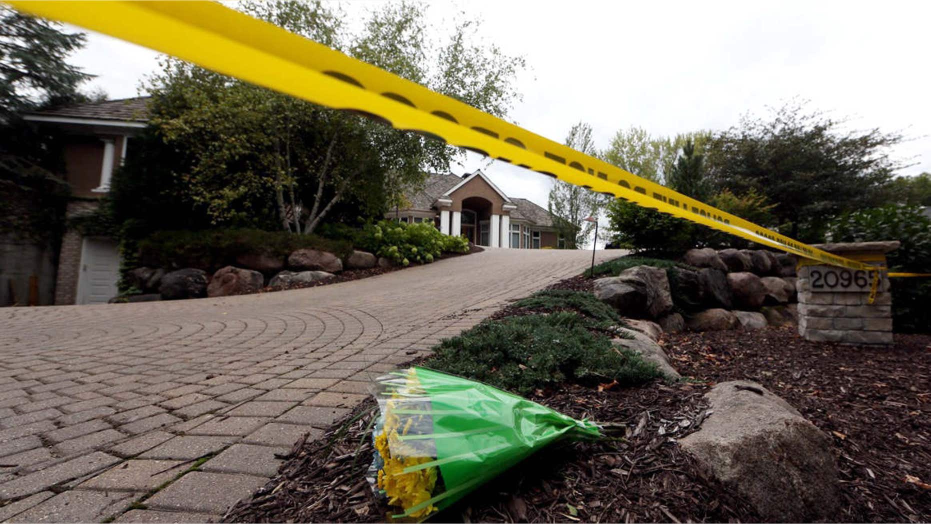 Sept. 11, 2015: Flowers rest outside the Short family's house in Greenwood, Minn.