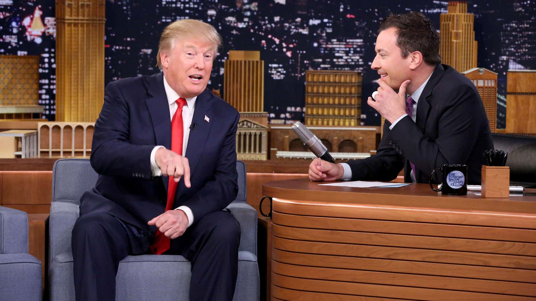 Sept. 11, 2015: In this image released by NBC, Republican presidential candidate Donald Trump, left, appears with host Jimmy Fallon during a taping of "The Tonight Show Starring Jimmy Fallon," in New York.