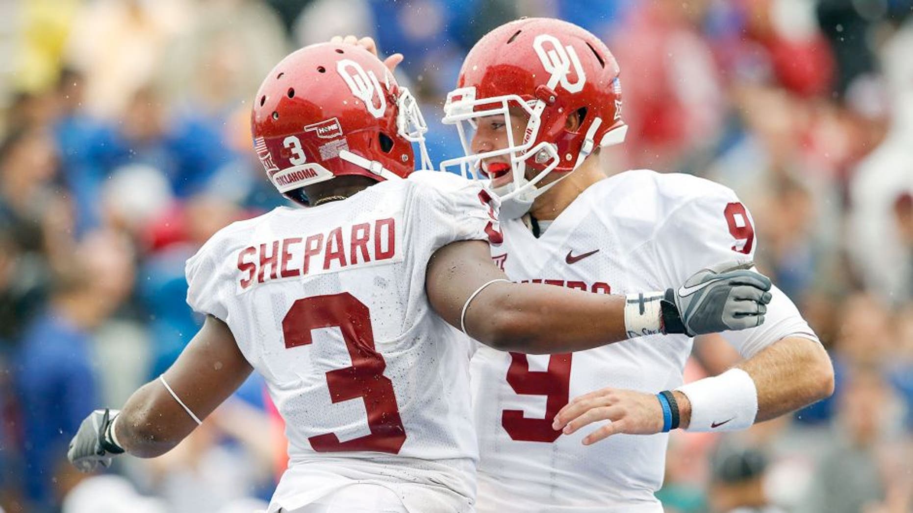 Sep 6, 2014; Tulsa, OK, USA; Oklahoma Sooners wide receiver Sterling Shepard (3) celebrates scoring a touchdown with quarterback Trevor Knight (9) during the second half against the Tulsa Golden Hurricane at Skelly Field at H.A. Chapman Stadium. Mandatory Credit: Kevin Jairaj-USA TODAY Sports
