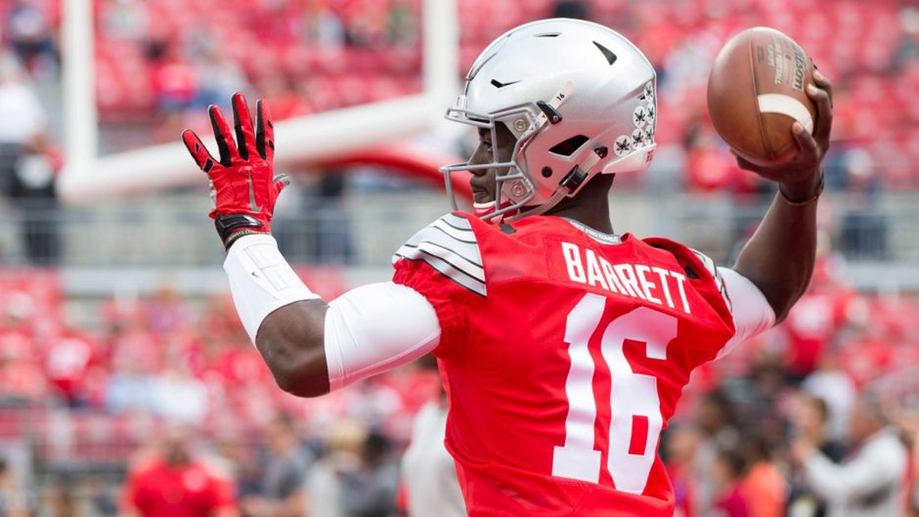 Sep 12, 2015; Columbus, OH, USA; Ohio State Buckeyes quarterback J.T. Barrett (16) warms up before the game against the Hawaii Warriors at Ohio Stadium. Mandatory Credit: Greg Bartram-USA TODAY Sports