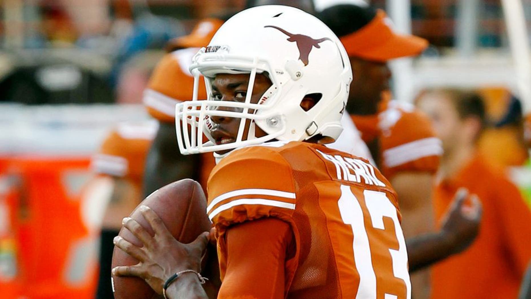AUSTIN, TX - SEPTEMBER 6: Jerrod Heard #13 of the Texas Longhorns passes during pre game warmups before playing the BYU Cougars on September 6, 2014 at Darrell K Royal-Texas Memorial Stadium in Austin, Texas. (Photo by Chris Covatta/Getty Images)