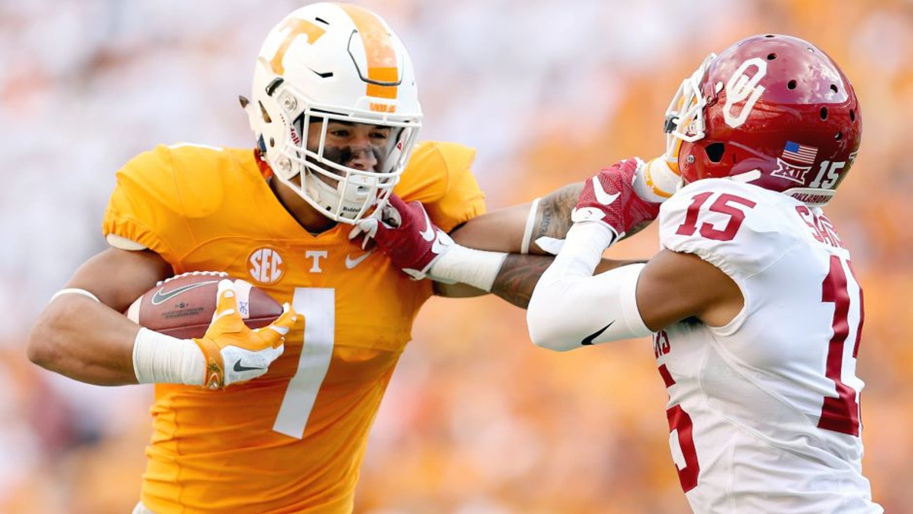 KNOXVILLE, TN - SEPTEMBER 12: Jalen Hurd #1 of the Tennessee Volunteers runs with the ball while defended by Zack Sanchez #25 of the Oklahoma Sooners during the game at Neyland Stadium on September 12, 2015 in Knoxville, Tennessee. (Photo by Andy Lyons/Getty Images)