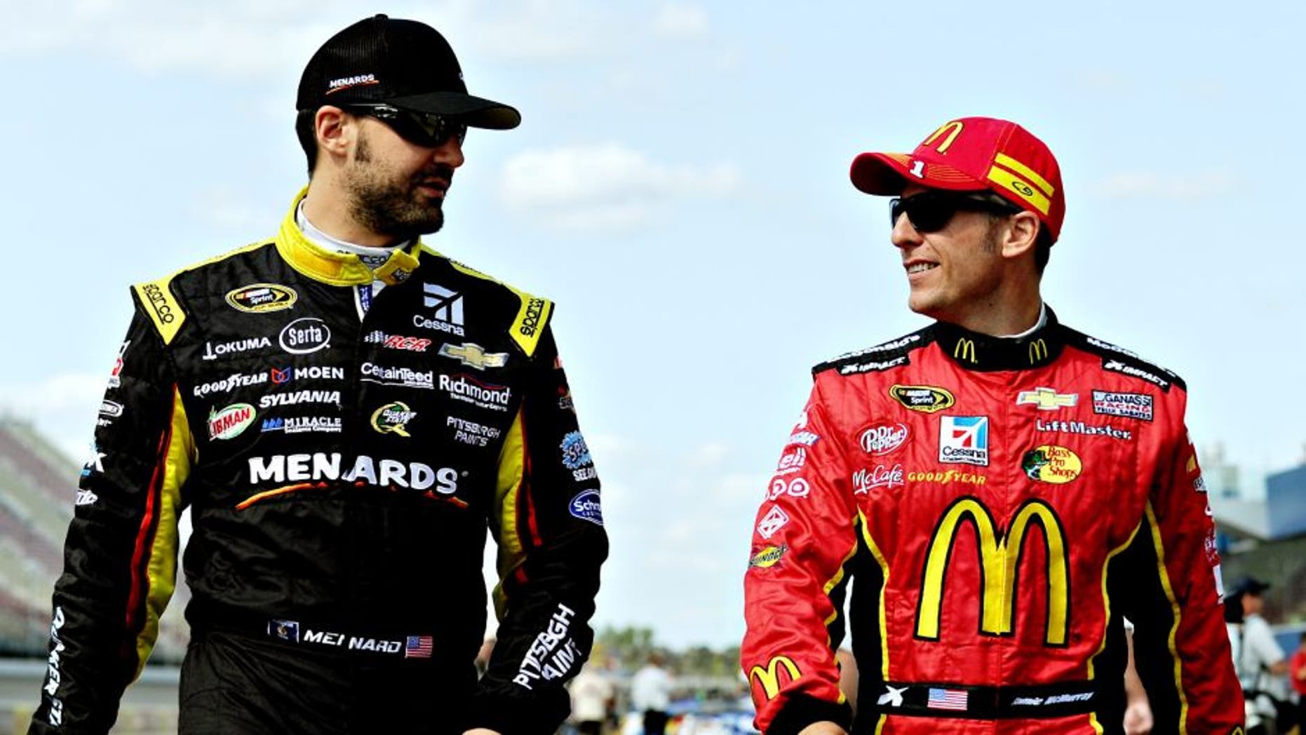 BROOKLYN, MI - AUGUST 15: Paul Menard (L), driver of the #27 CertainTeed/Menard's Chevrolet, talks to Jamie McMurray, driver of the #1 McDonald's Chevrolet, on the grid during qualifying for the NASCAR Sprint Cup Series Pure Michigan 400 at Michigan International Speedway on August 15, 2014 in Brooklyn, Michigan. (Photo by Will Schneekloth/NASCAR via Getty Images)