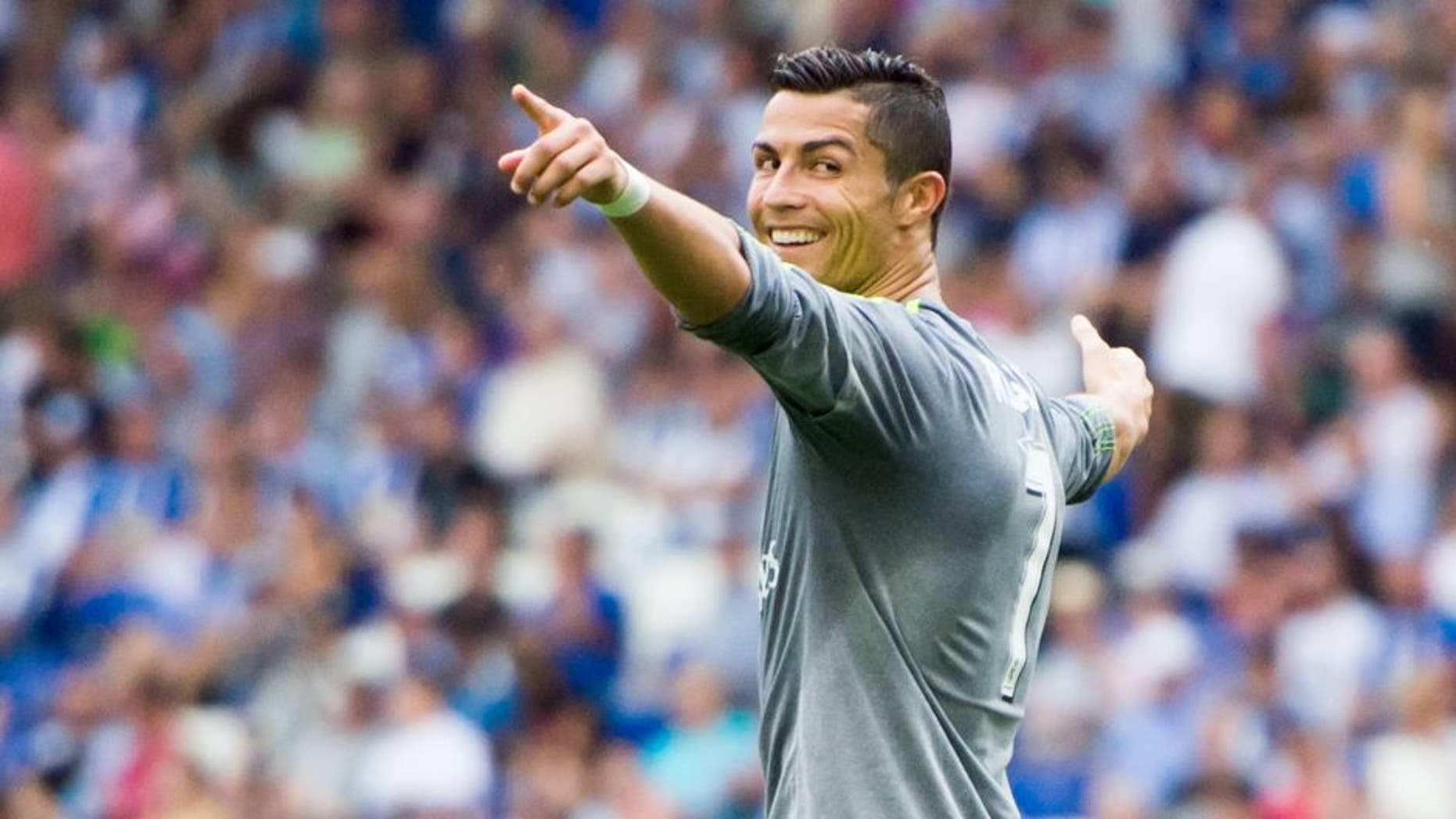 BARCELONA, SPAIN - SEPTEMBER 12: Cristiano Ronaldo of Real Madrid CF celebrates after scoring his team's sixth goal during the La Liga match between RCD Espanyol and Real Madrid CF at Cornella-El Prat Stadium on September 12, 2015 in Barcelona, Spain. (Photo by Alex Caparros/Getty Images)
