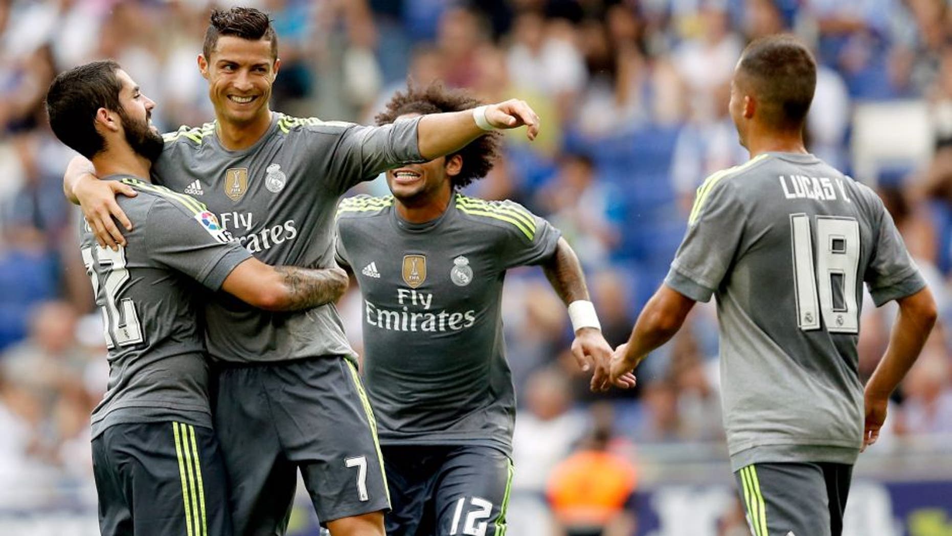 MADRID, SPAIN - AUGUST 29: Cristiano Ronaldo of Real Madrid celebrates whit his teammates after scoring a goal during the La Liga match between Espanyol and Real Madrid at Cornella-El Prat Stadium on September 12, 2015 in Barcelona, Spain. (Photo by Antonio Villalba/Real Madrid via Getty Images)