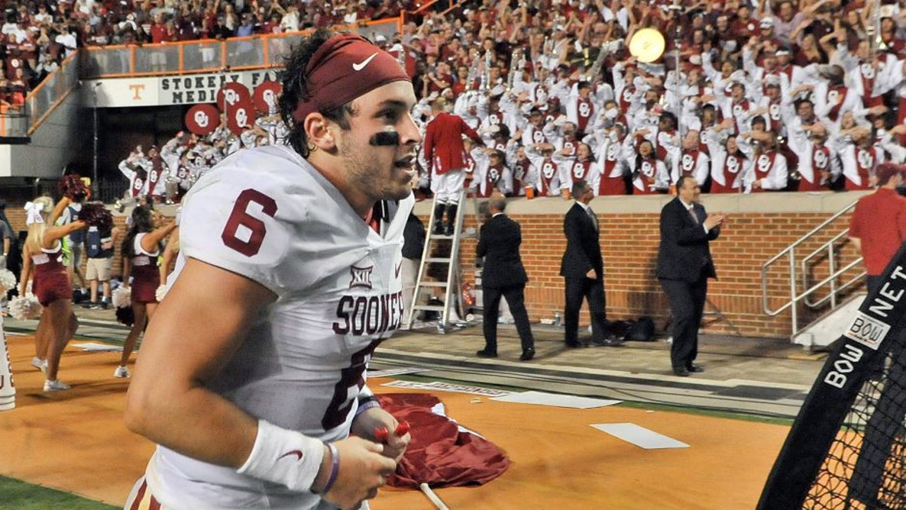 Sep 12, 2015; Knoxville, TN, USA; Oklahoma Sooners quarterback Baker Mayfield (6) runs off the field after defeating the Tennessee Volunteers in double overtime Neyland Stadium. Oklahoma won 31-24. Mandatory Credit: Jim Brown-USA TODAY Sports