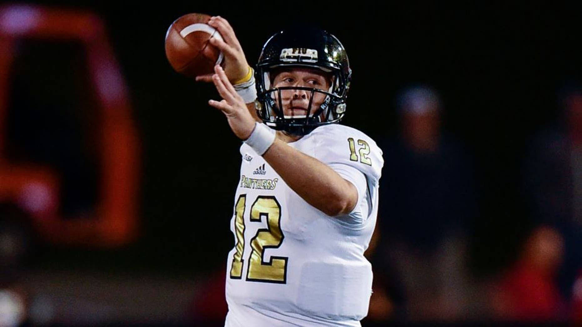 Sep 12, 2015; Bloomington, IN, USA;Florida International University Golden Panthers quarterback Alex McGough (12) throws to a teammate during the first quarter of the game against Indiana Hoosiers at Memorial Stadium. Mandatory Credit: Marc Lebryk-USA TODAY Sports