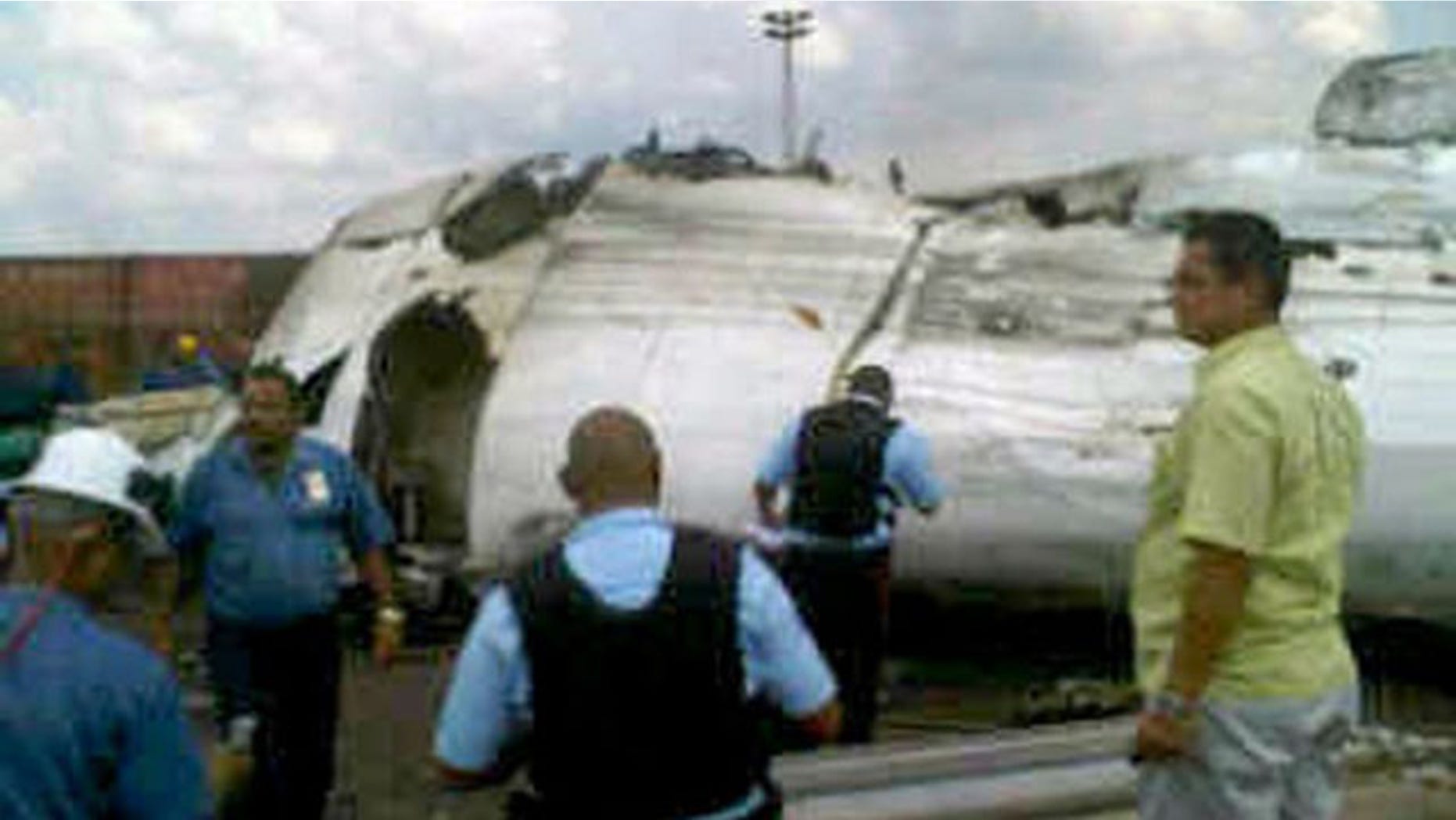 Sept. 13: A picture shows rescue workers at the place where an ATR-42 plane crashed in Puerto Ordaz. The plane owned by Venezuela's state-run airline Conviasa crashed Monday during a domestic flight with 47 people on board and came down on property belonging to government steel maker Sidor, authorities said (Reuters).
