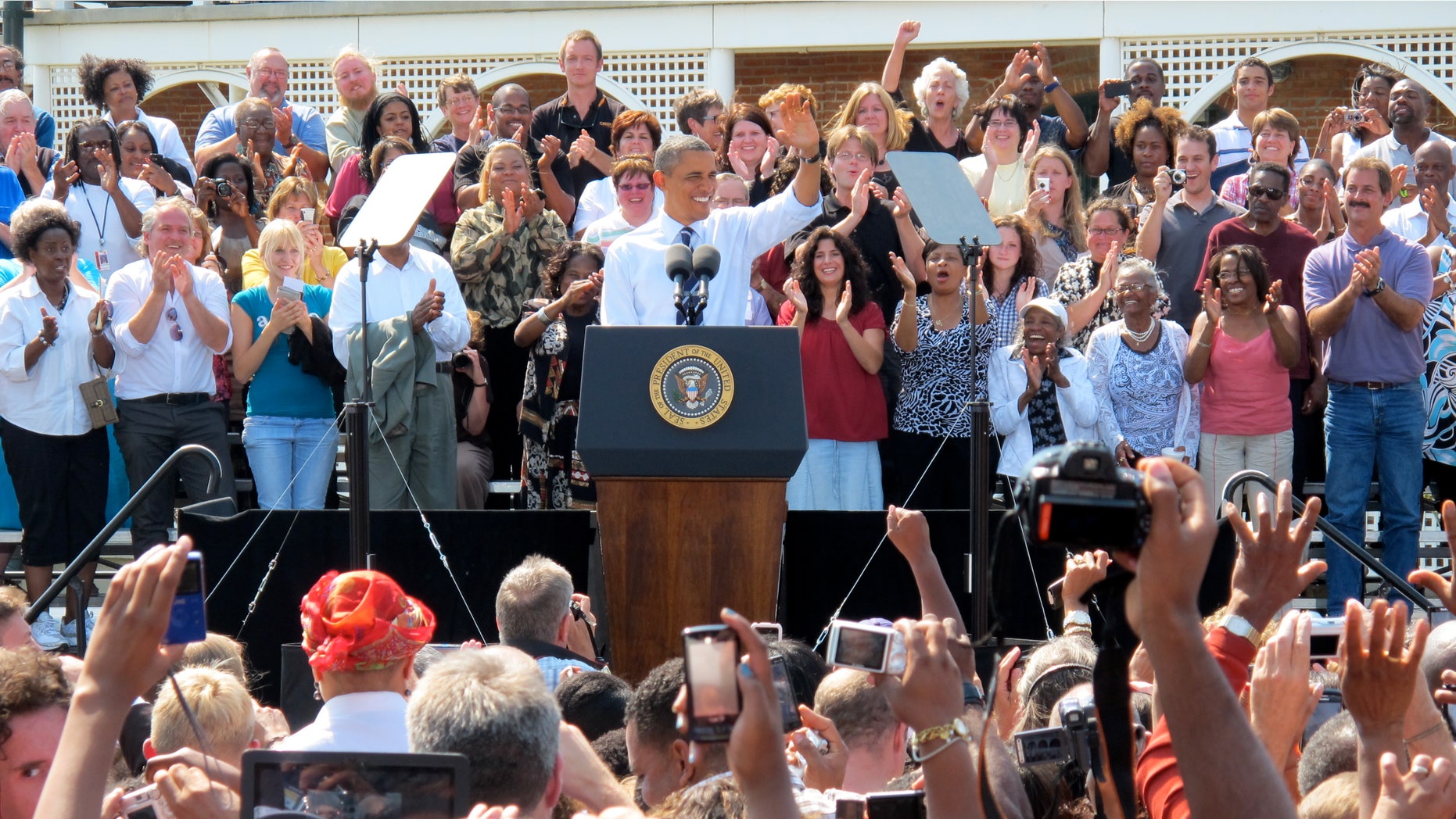 Tuesday: President Obama waves to supporters during an event at Fort Hayes Arts and Academics High School in Columbus, Ohio.
