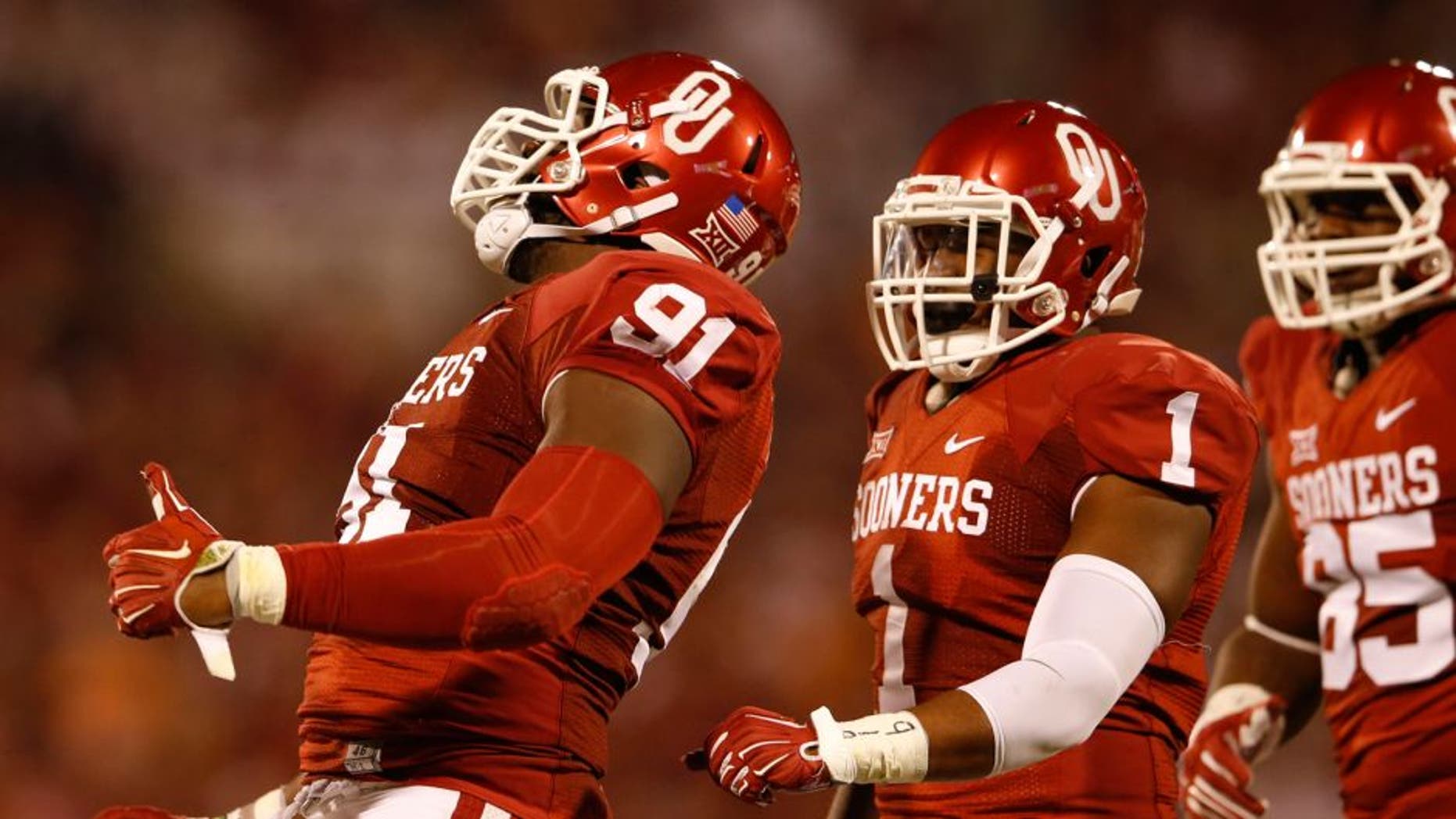 Sep 13, 2014; Norman, OK, USA; Oklahoma Sooners defensive end Charles Tapper (91) and linebacker Dominique Alexander (1) react during the game against the Tennessee Volunteers at Gaylord Family - Oklahoma Memorial Stadium. Mandatory Credit: Kevin Jairaj-USA TODAY Sports