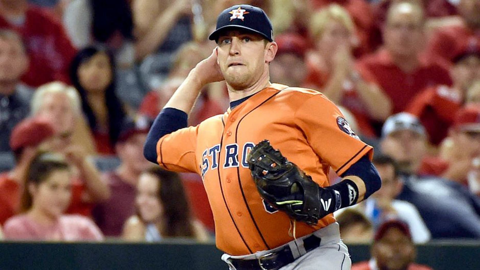 September 11, 2015; Anaheim, CA, USA; Houston Astros third baseman Jed Lowrie (8) throws to first in the fifth inning against the Los Angeles Angels at Angel Stadium of Anaheim. Mandatory Credit: Richard Mackson-USA TODAY Sports