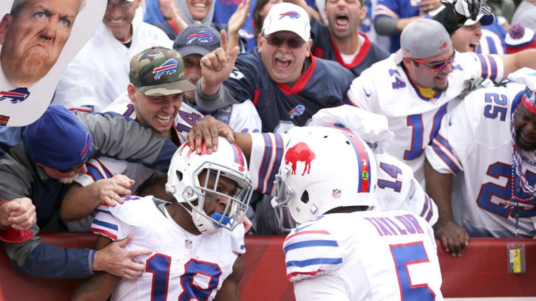 ORCHARD PARK, NY - SEPTEMBER 13: Percy Harvin #18 of the Buffalo Bills celebrates his touchdown with Tyrod Taylor #5 of the Buffalo Bills against the Indianapolis Colts during the first half at Ralph Wilson Stadium on September 13, 2015 in Orchard Park, New York. (Photo by Brett Carlsen/Getty Images)