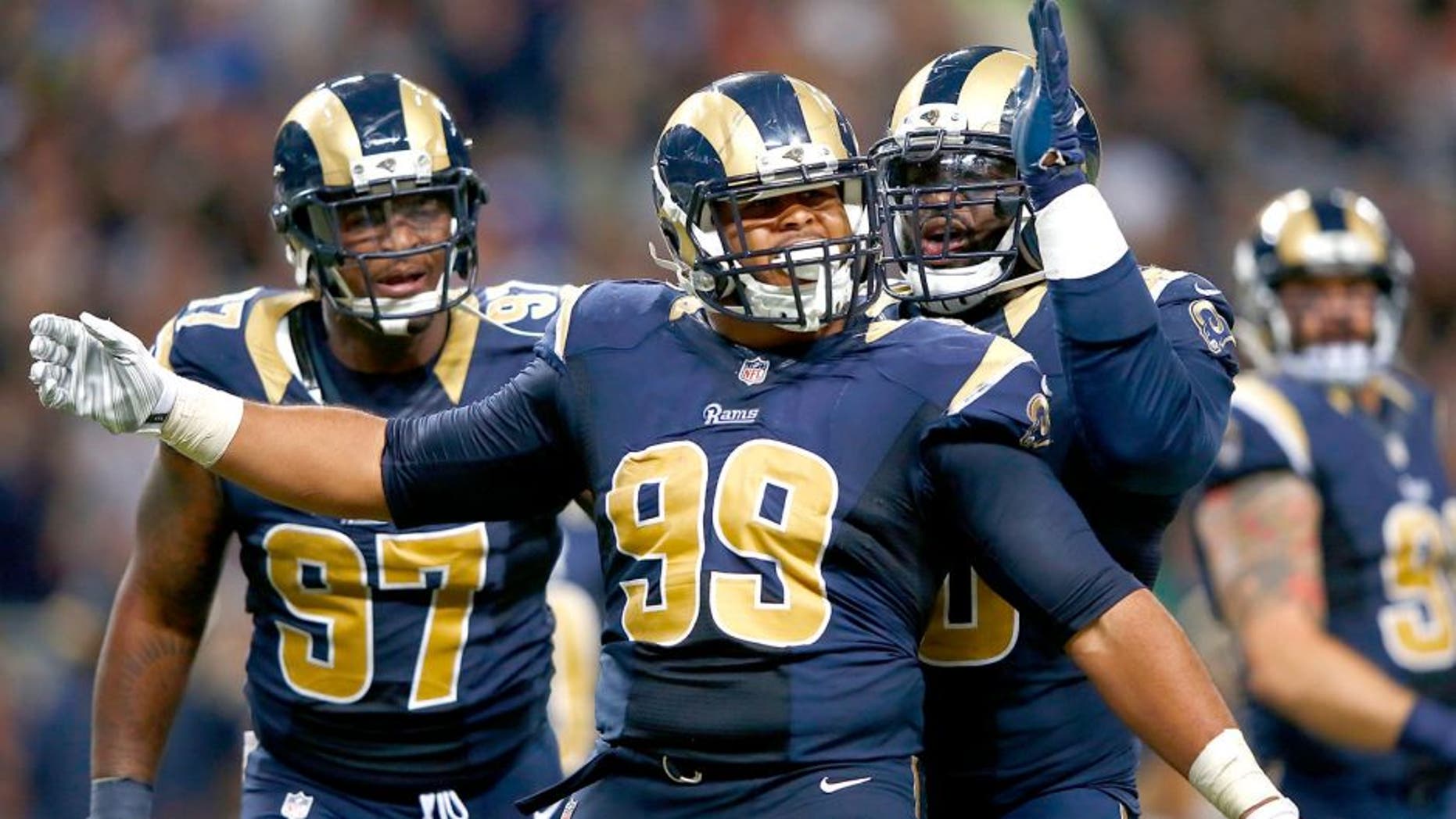 ST. LOUIS, MO - SEPTEMBER 13: Aaron Donald #99 of the St. Louis Rams celebrates a third quarter sack against the Seattle Seahawks at the Edward Jones Dome on September 13, 2015 in St. Louis, Missouri. (Photo by Jamie Squire/Getty Images)