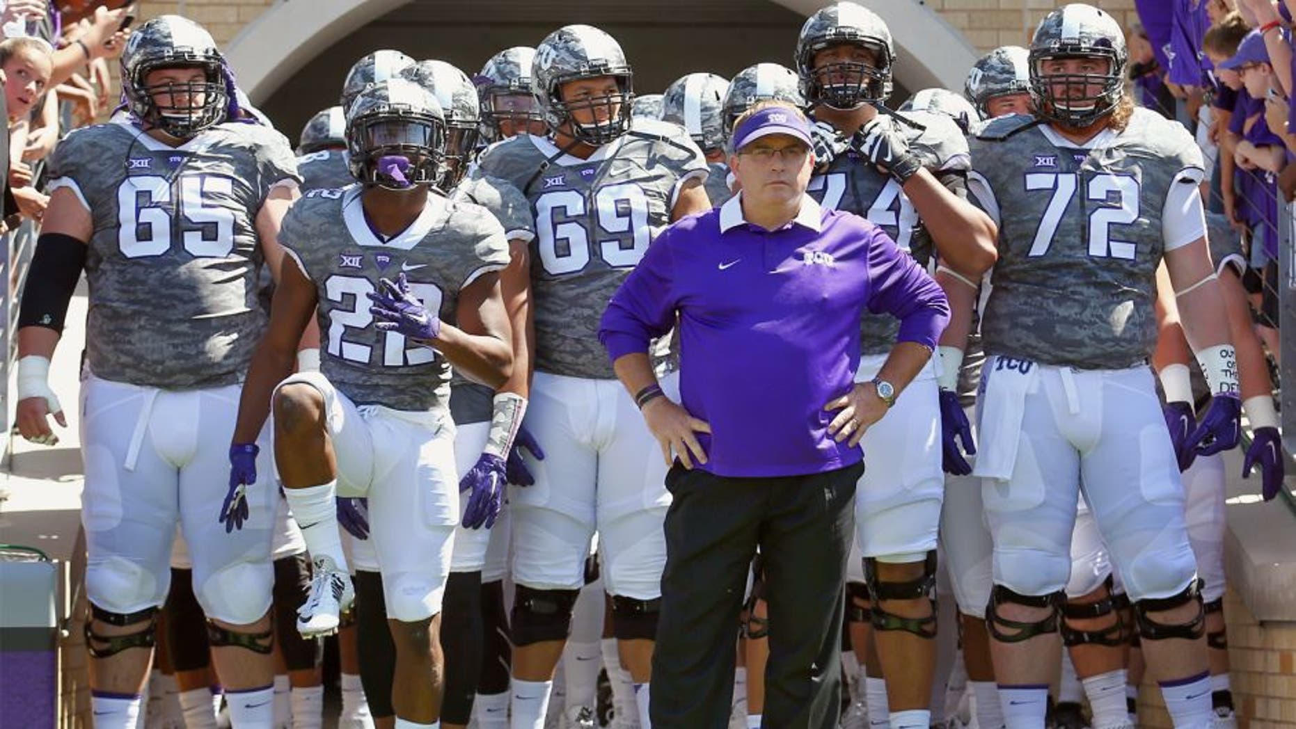FORT WORTH, TX - SEPTEMBER 12: Head coach Gary Patterson of the TCU Horned Frogs leads his team onto the field to take on the Stephen F. Austin Lumberjacks at Amon G. Carter Stadium on September 12, 2015 in Fort Worth, Texas. (Photo by Tom Pennington/Getty Images)