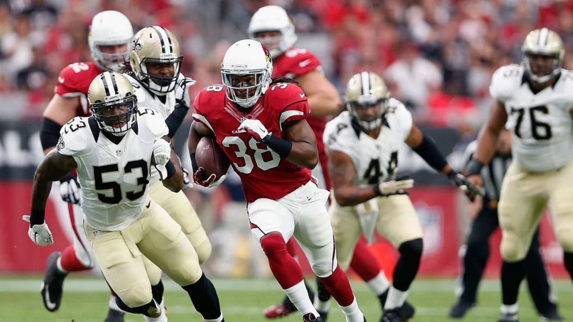 GLENDALE, AZ - SEPTEMBER 13: Running back Andre Ellington #38 of the Arizona Cardinals runs past Inside linebacker Ramon Humber #53 of the New Orleans Saints during the first half of the NFL game at the University of Phoenix Stadium on September 13, 2015 in Glendale, Arizona. (Photo by Christian Petersen/Getty Images)