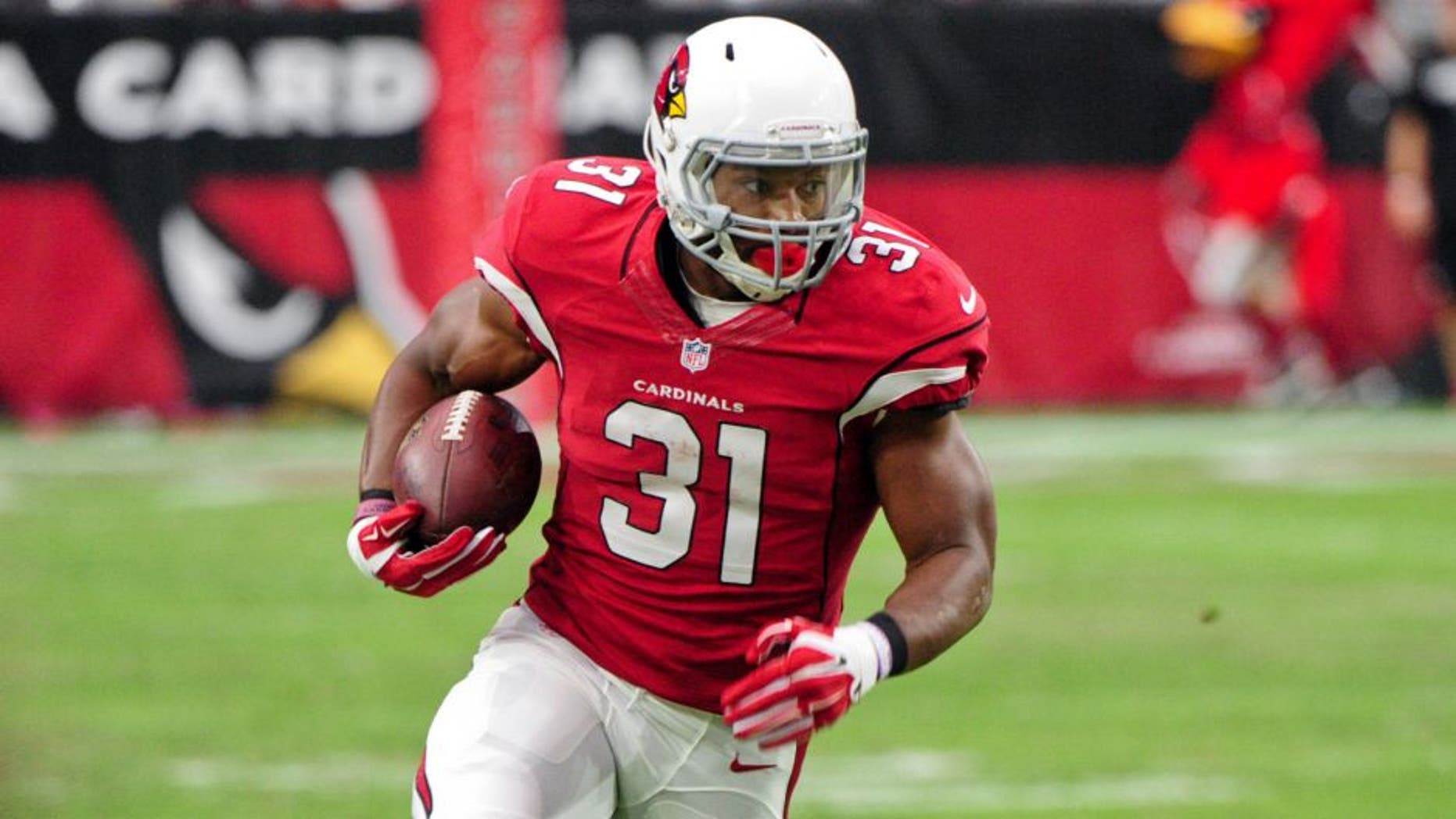 Sep 13, 2015; Glendale, AZ, USA; Arizona Cardinals running back David Johnson (31) carries the ball on a 55 yard touchdown run in the second half against the New Orleans Saints at University of Phoenix Stadium. Mandatory Credit: Matt Kartozian-USA TODAY Sports