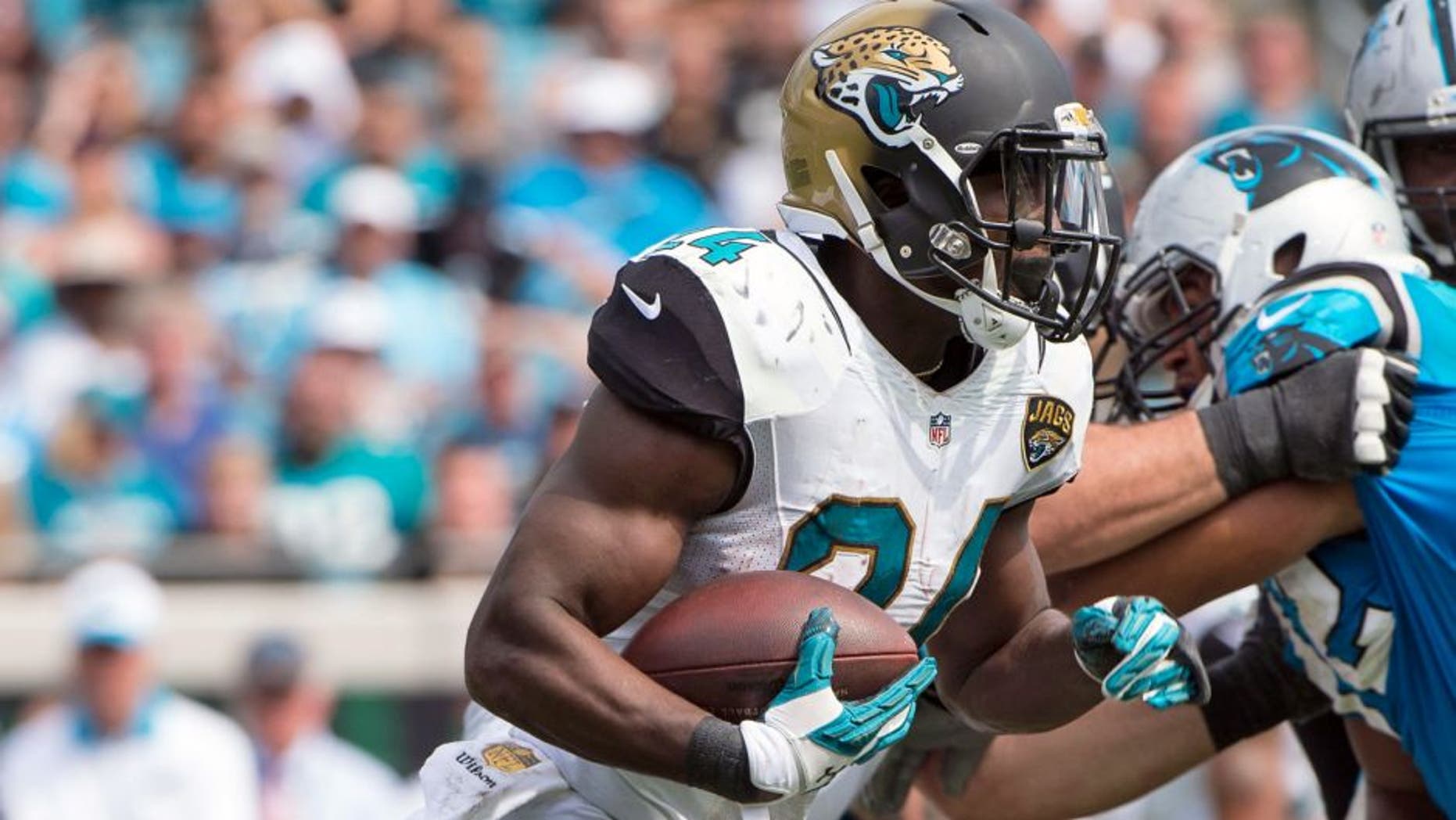 Sep 13, 2015; Jacksonville, FL, USA; Jacksonville Jaguars running back T.J. Yeldon (24) runs with the ball against the Carolina Panthers during the second half at EverBank Field. The Panthers defeat the Jaguars 20-9. Mandatory Credit: Jerome Miron-USA TODAY Sports
