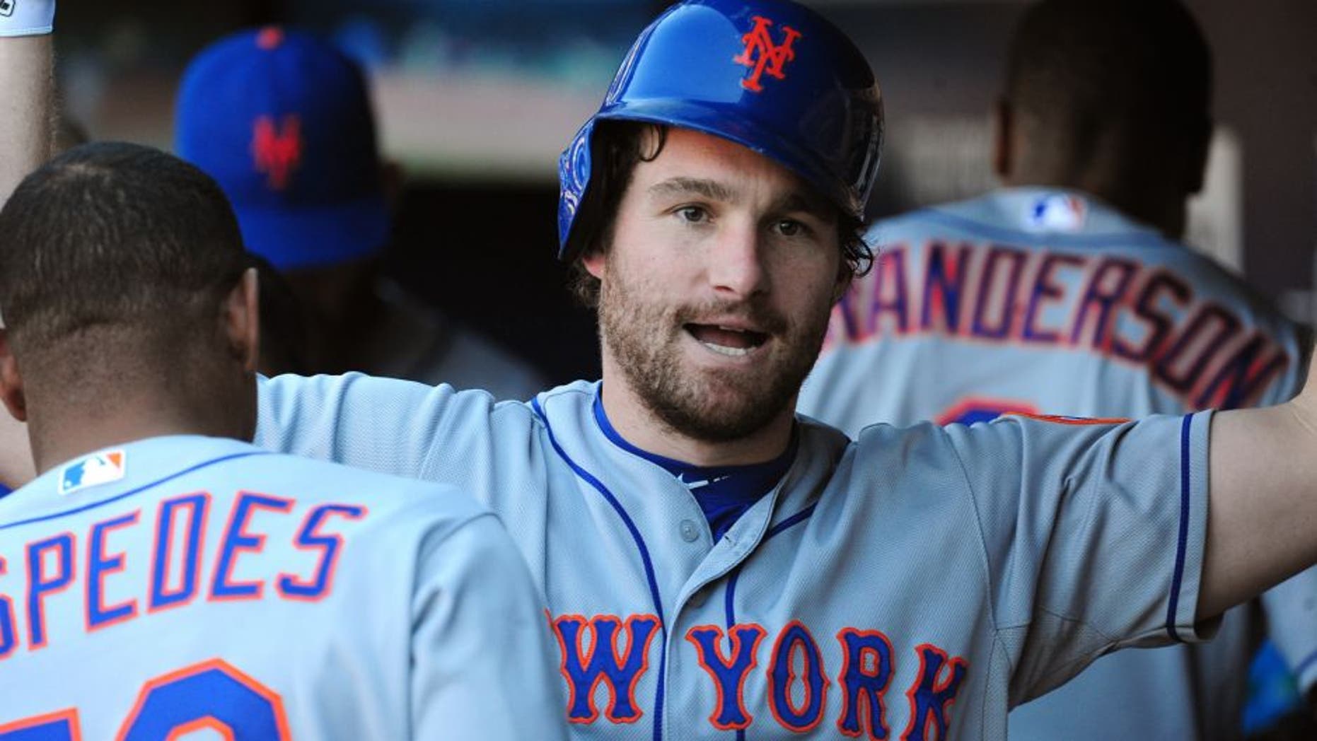 ATLANTA, GA - SEPTEMBER 13: Daniel Murphy #28 of the New York Mets celebrates with teammates after hitting a three-run ninth inning home run against the Atlanta Braves at Turner Field on September 13, 2015 in Atlanta, Georgia. (Photo by Scott Cunningham/Getty Images)