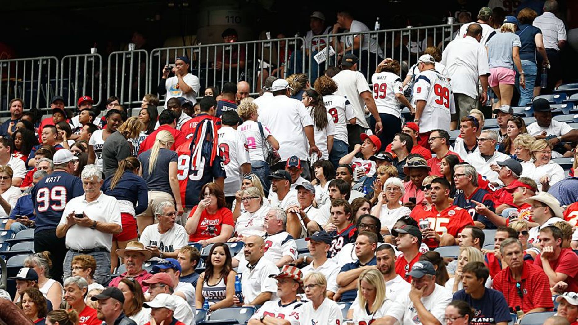 HOUSTON, TX - SEPTEMBER 13: Houston Texans fans leave early while the Texans play the Kansas City Chiefs in the second half in the second quarter in a NFL game on September 13, 2015 at NRG Stadium in Houston, Texas. (Photo by Bob Levey/Getty Images)