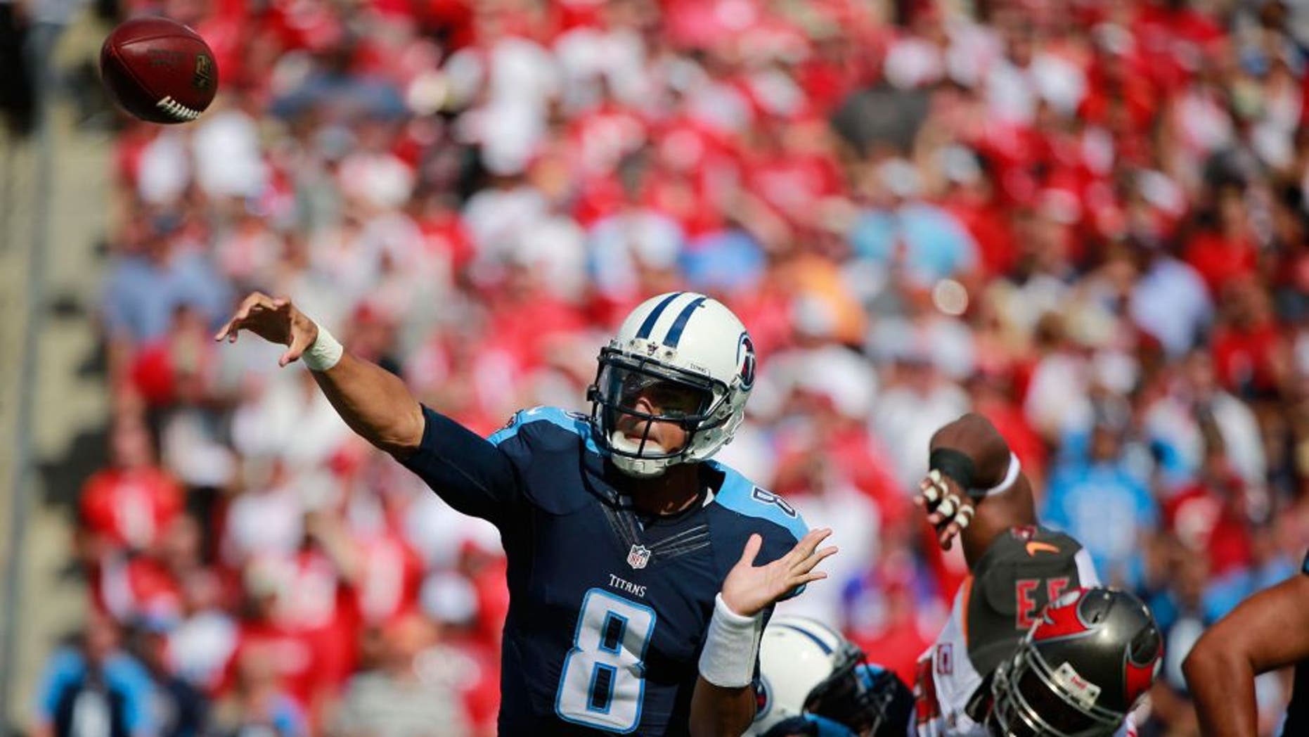 Sep 13, 2015; Tampa, FL, USA; Tennessee Titans quarterback Marcus Mariota (8) throws the ball against the Tampa Bay Buccaneers during the first quarter at Raymond James Stadium. Mandatory Credit: Kim Klement-USA TODAY Sports
