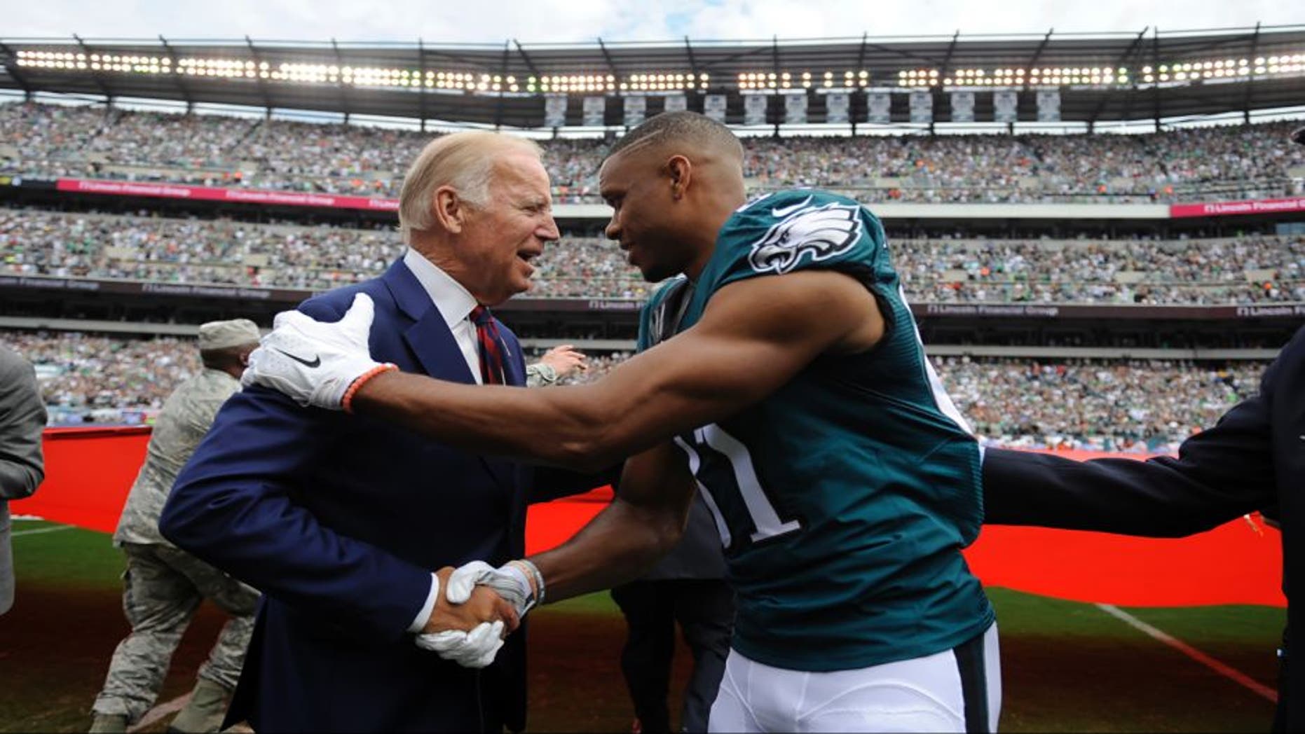 Philadelphia Eagles wide receiver Jordan Matthews, right, meets with Vice President Joe Biden before an NFL football game against the Cleveland Browns, Sunday, Sept. 11, 2016, in Philadelphia. (AP Photo/Michael Perez) ORG XMIT: _1MP6873