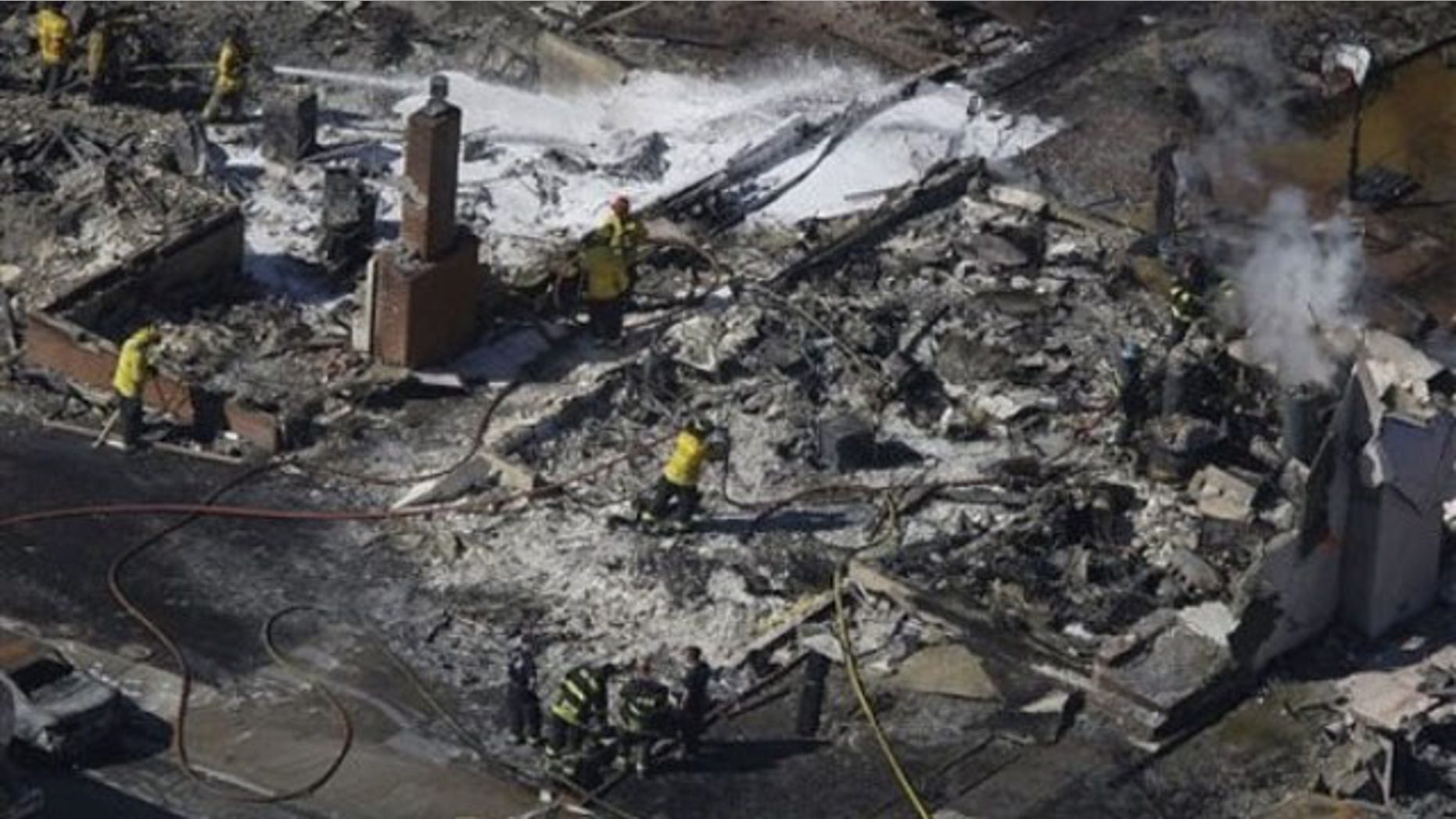 Sept. 10: Firemen work on the remains of a home damaged by a massive fire in a mostly residential neighborhood in San Bruno, Calif. (AP).