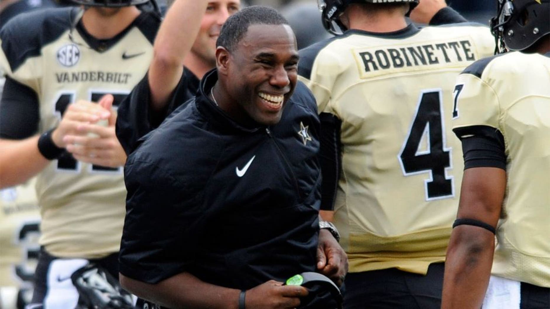 Sep 13, 2014; Nashville, TN, USA; Vanderbilt Commodores head coach Derek Mason celebrates after a touchdown during the first half against the Massachusetts Minutemen at Vanderbilt Stadium. Mandatory Credit: Christopher Hanewinckel-USA TODAY Sports