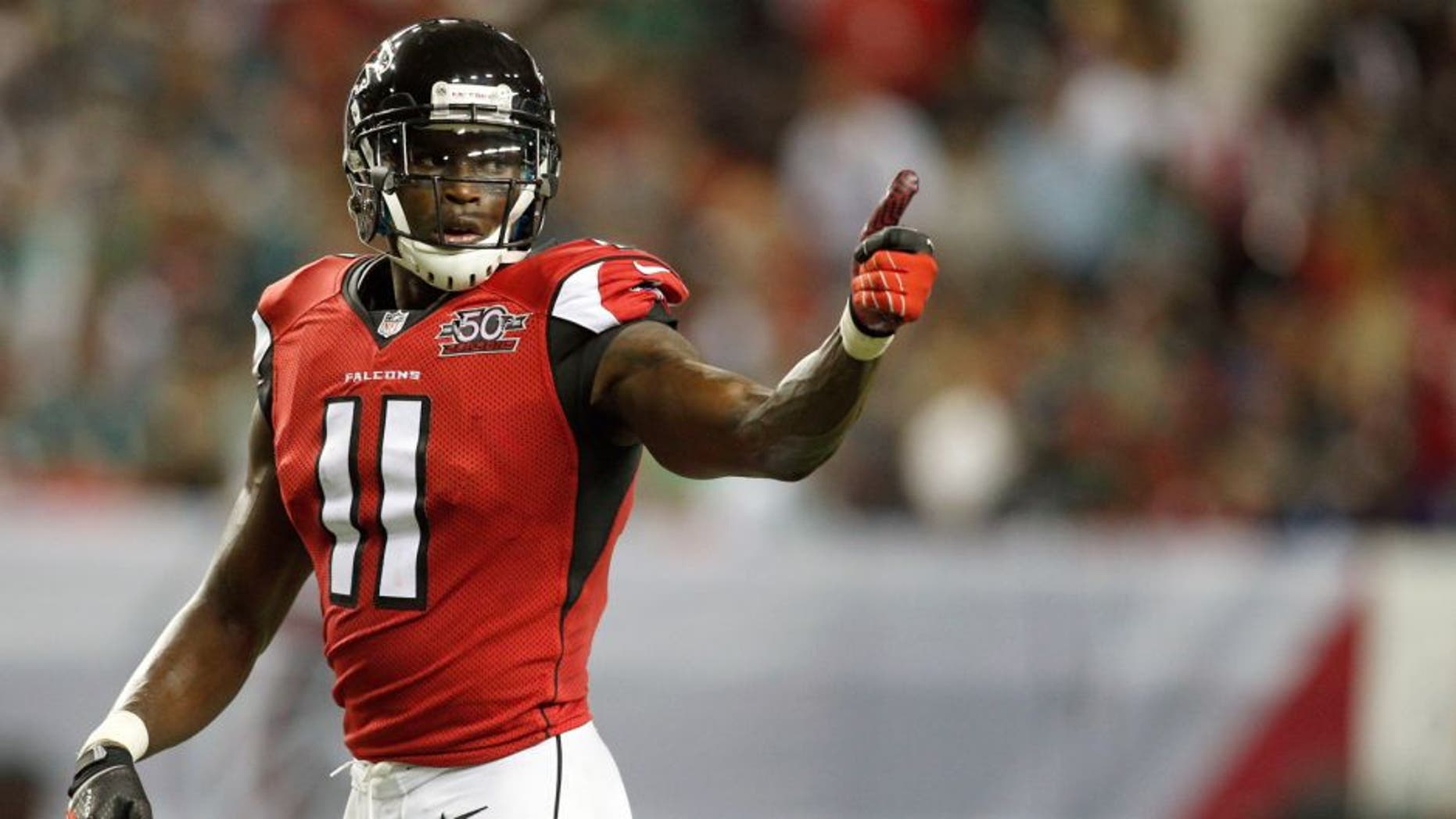 Sep 14, 2015; Atlanta, GA, USA; Atlanta Falcons wide receiver Julio Jones (11) gestures to the sideline against the Philadelphia Eagles in the second quarter at the Georgia Dome. Mandatory Credit: Brett Davis-USA TODAY Sports