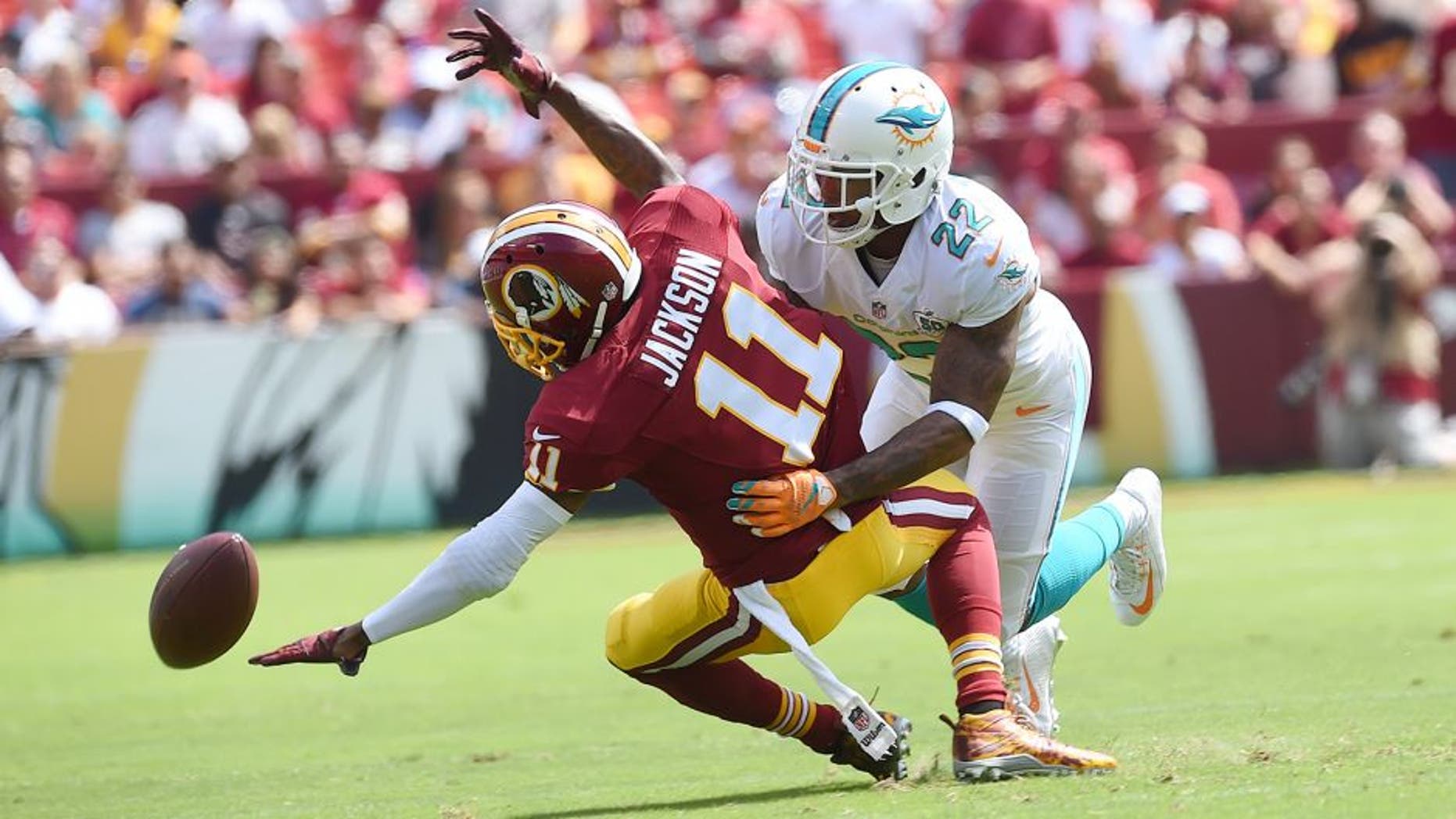 LANDOVER, MD - SEPTEMBER 13: Miami Dolphins cornerback Jamar Taylor (22) is called for pass interference as he defends Washington Redskins wide receiver DeSean Jackson (11) in the first quarter during the game between the Washington Redskins and the Miami Dolphins at FedEx Field on Sunday, September 13, 2015. (Photo by Toni L. Sandys/ The Washington Post via Getty Images)