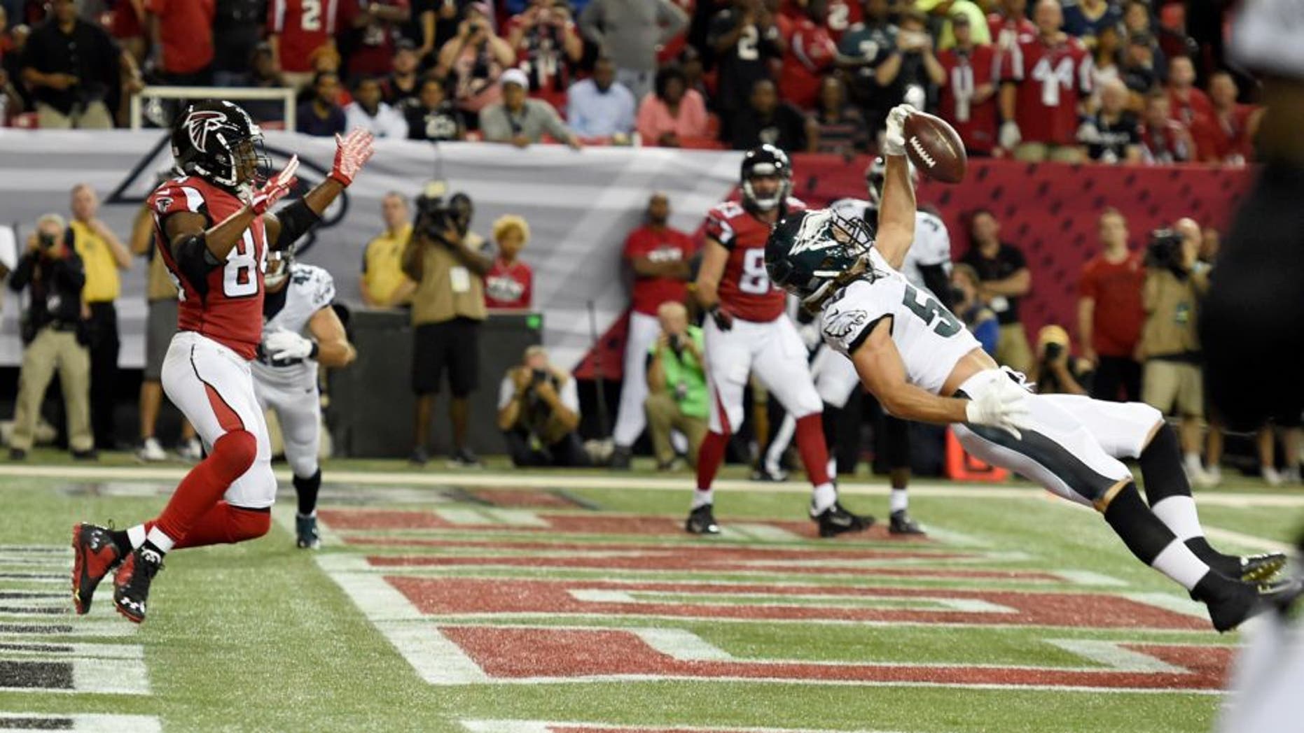 Sep 14, 2015; Atlanta, GA, USA; Philadelphia Eagles linebacker Kiko Alonso (50) intercepts a pass intended for Atlanta Falcons wide receiver Roddy White (84) in the first quarter at the Georgia Dome. Mandatory Credit: Dale Zanine-USA TODAY Sports