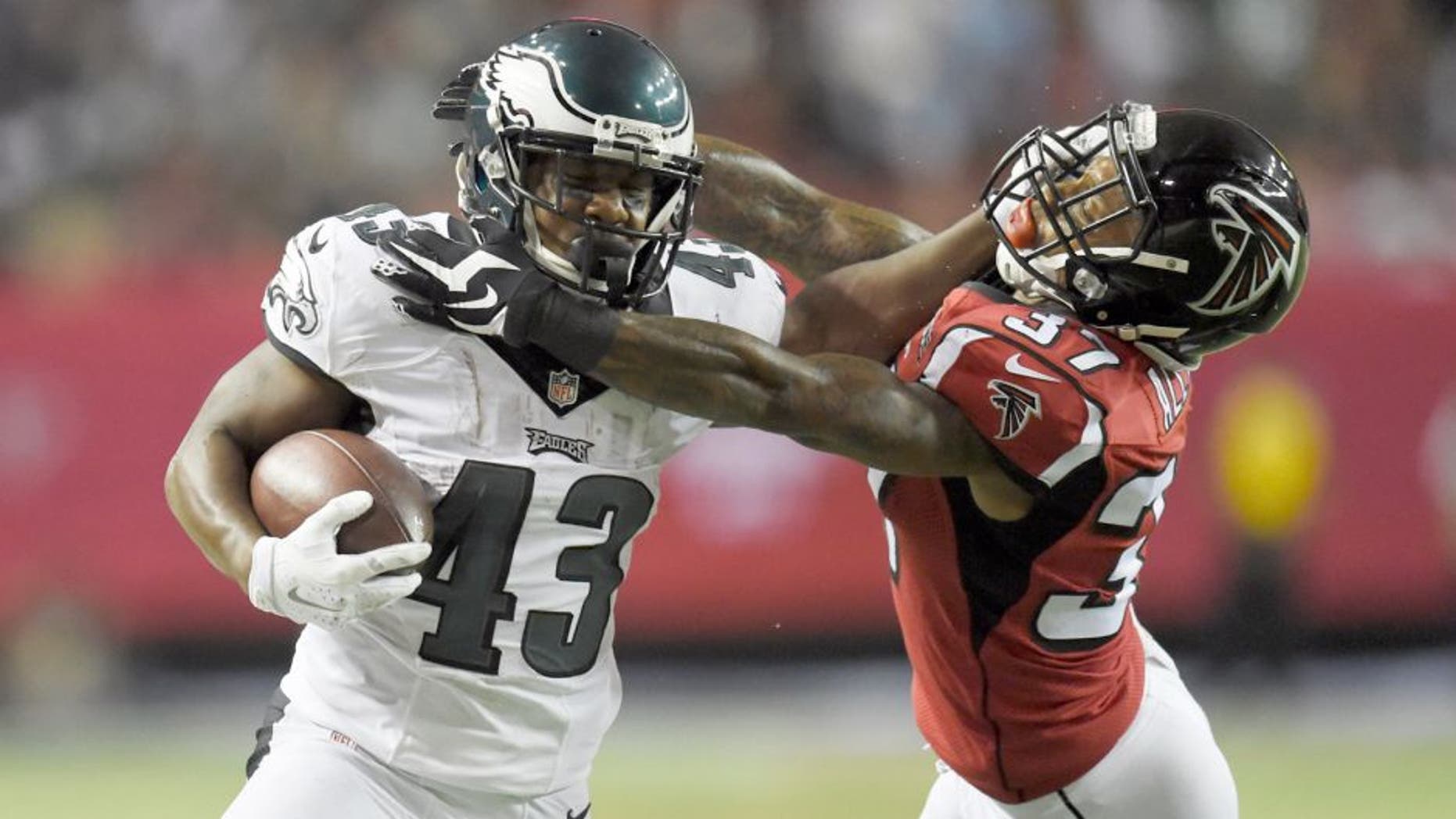 Sep 14, 2015; Atlanta, GA, USA; Philadelphia Eagles running back Darren Sproles (43) is tackled by Atlanta Falcons cornerback Ricardo Allen (37) in the third quarter at the Georgia Dome. Mandatory Credit: Dale Zanine-USA TODAY Sports